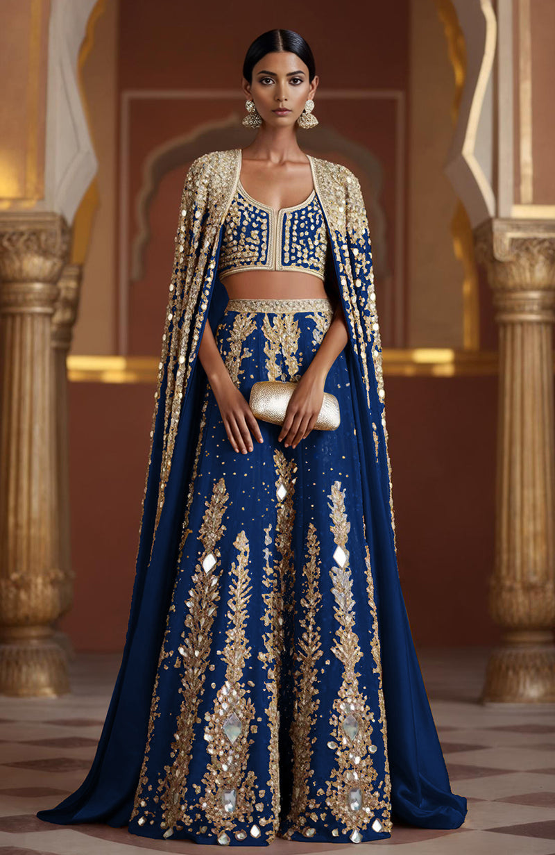 Sapphire blue lehenga with mirrorwork and a full-length matching mirror cape from Jalwa collection.