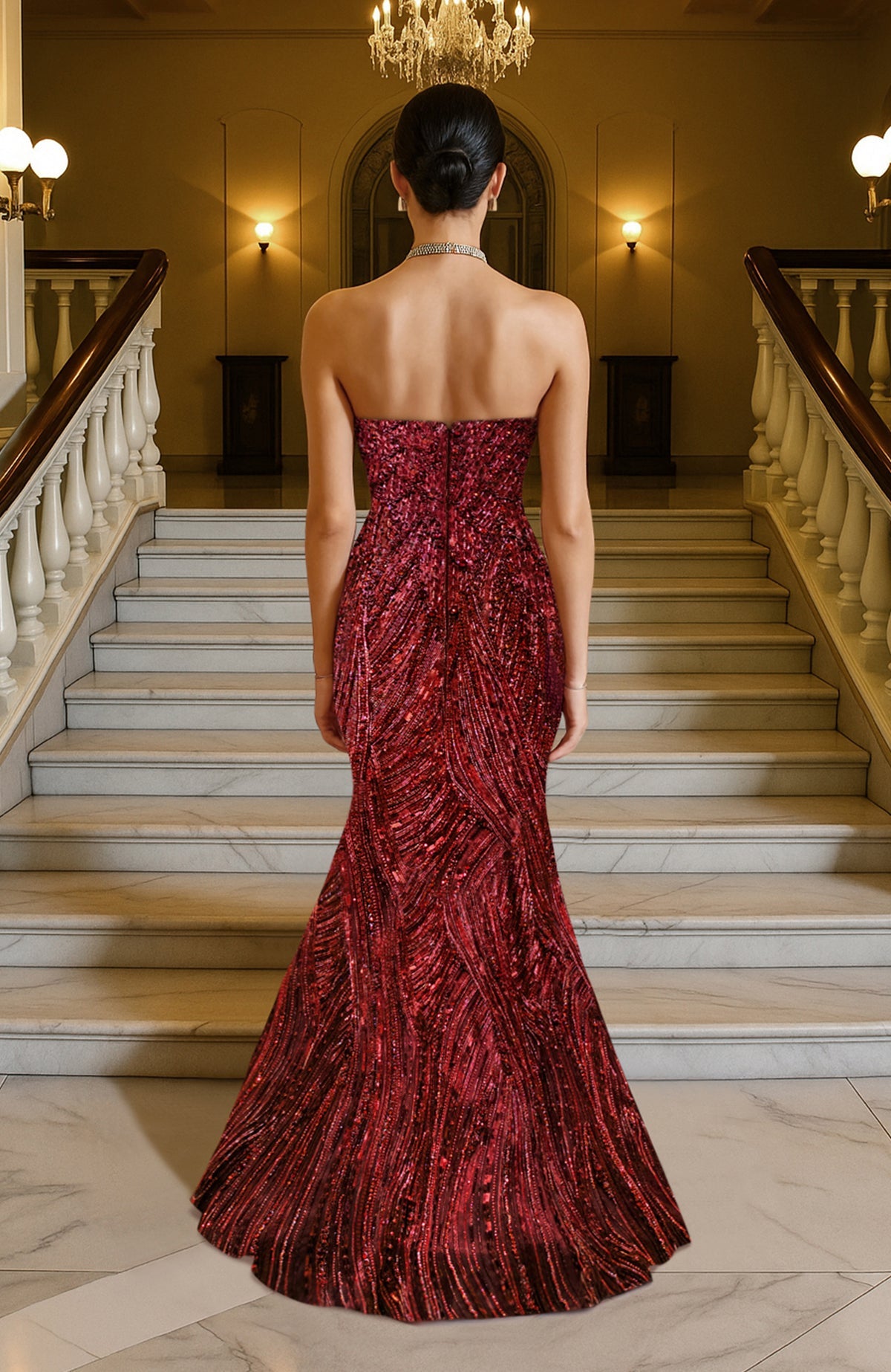 A deep red, strapless mermaid gown with intricate sequin embellishments and a sweetheart neckline.