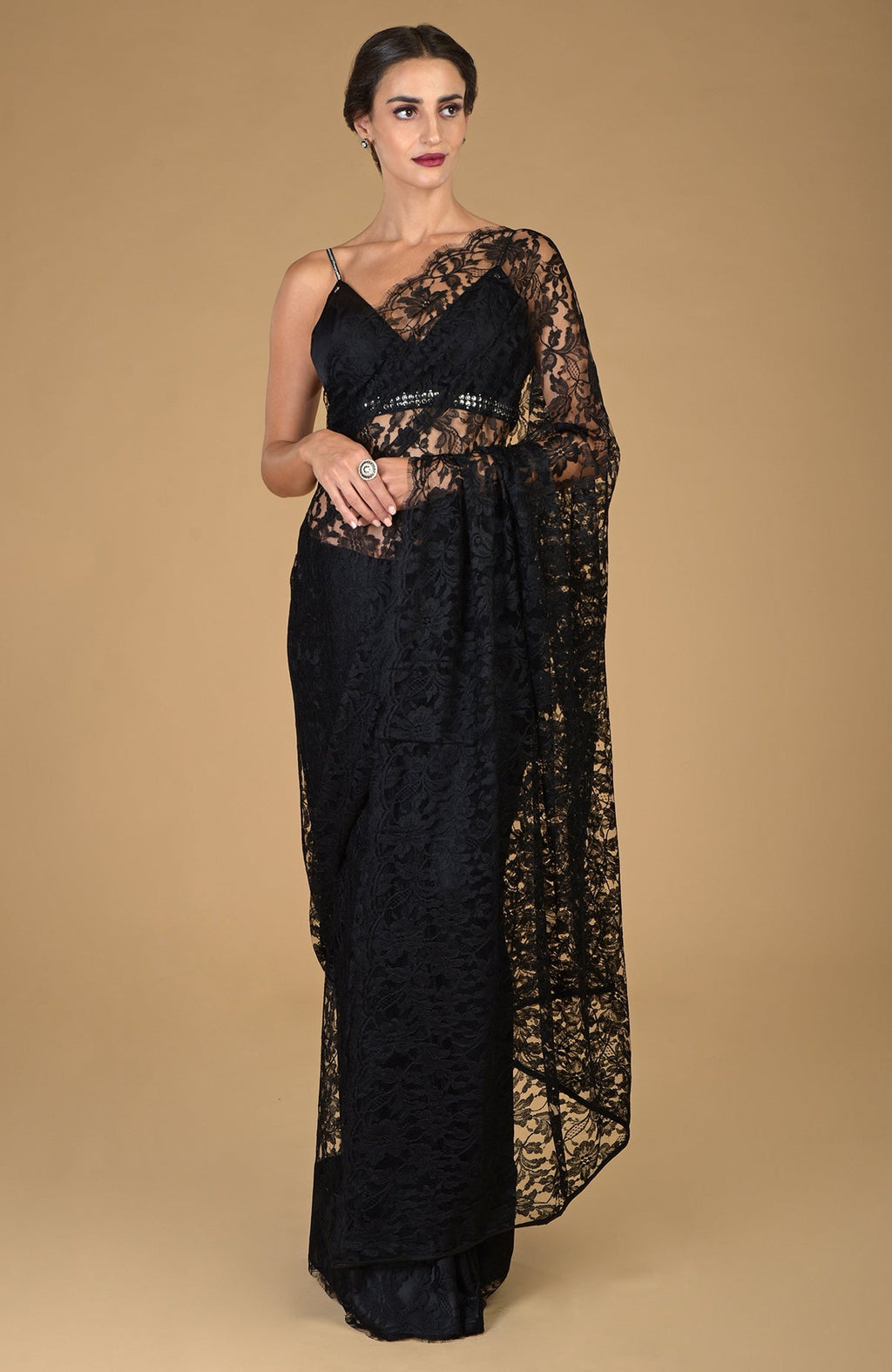 Black French Chantilly lace saree with an embellished blouse.