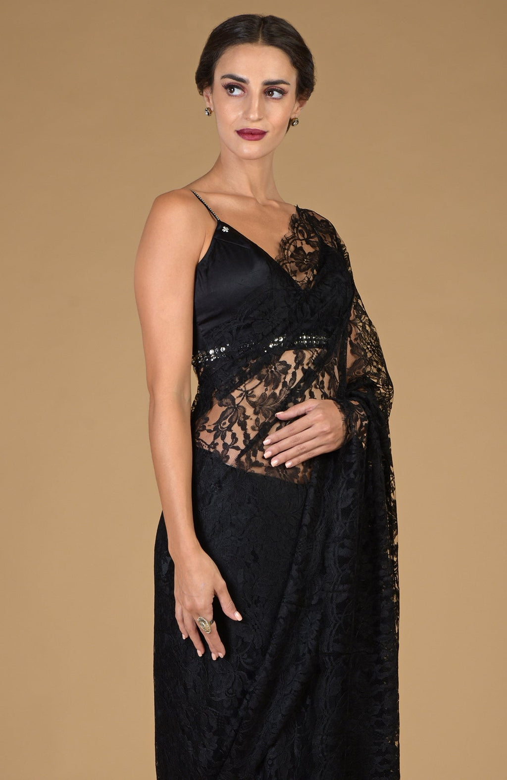Black French Chantilly lace saree with an embellished blouse.