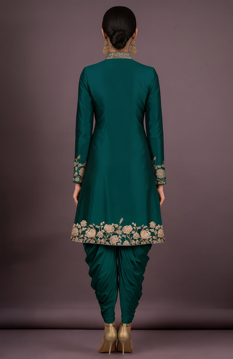Emerald green silk jacket with gold floral embroidery and matching draped dhoti pants.