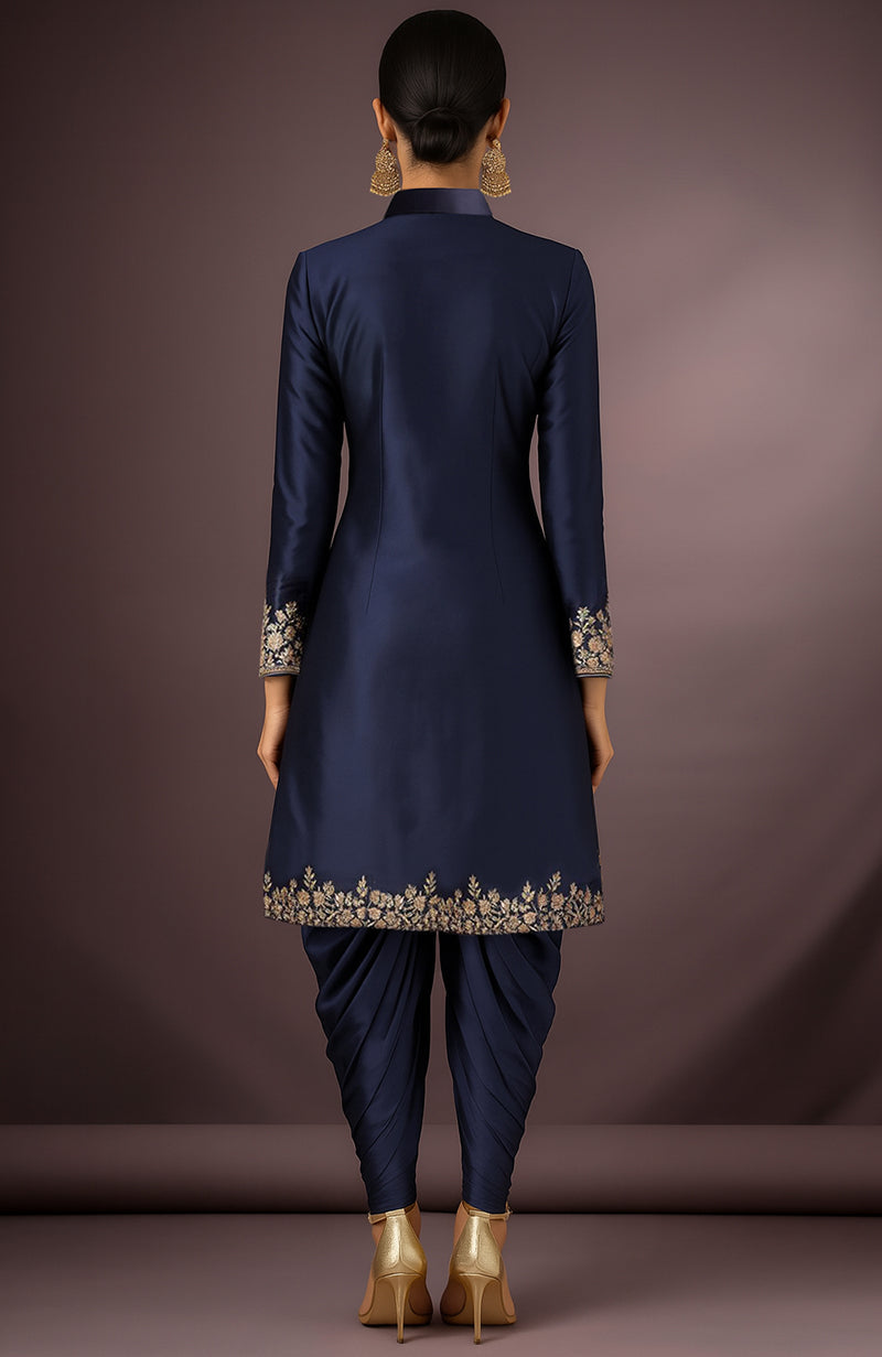 Midnight navy silk sherwani jacket with gold floral embroidery and matching dhoti trousers.