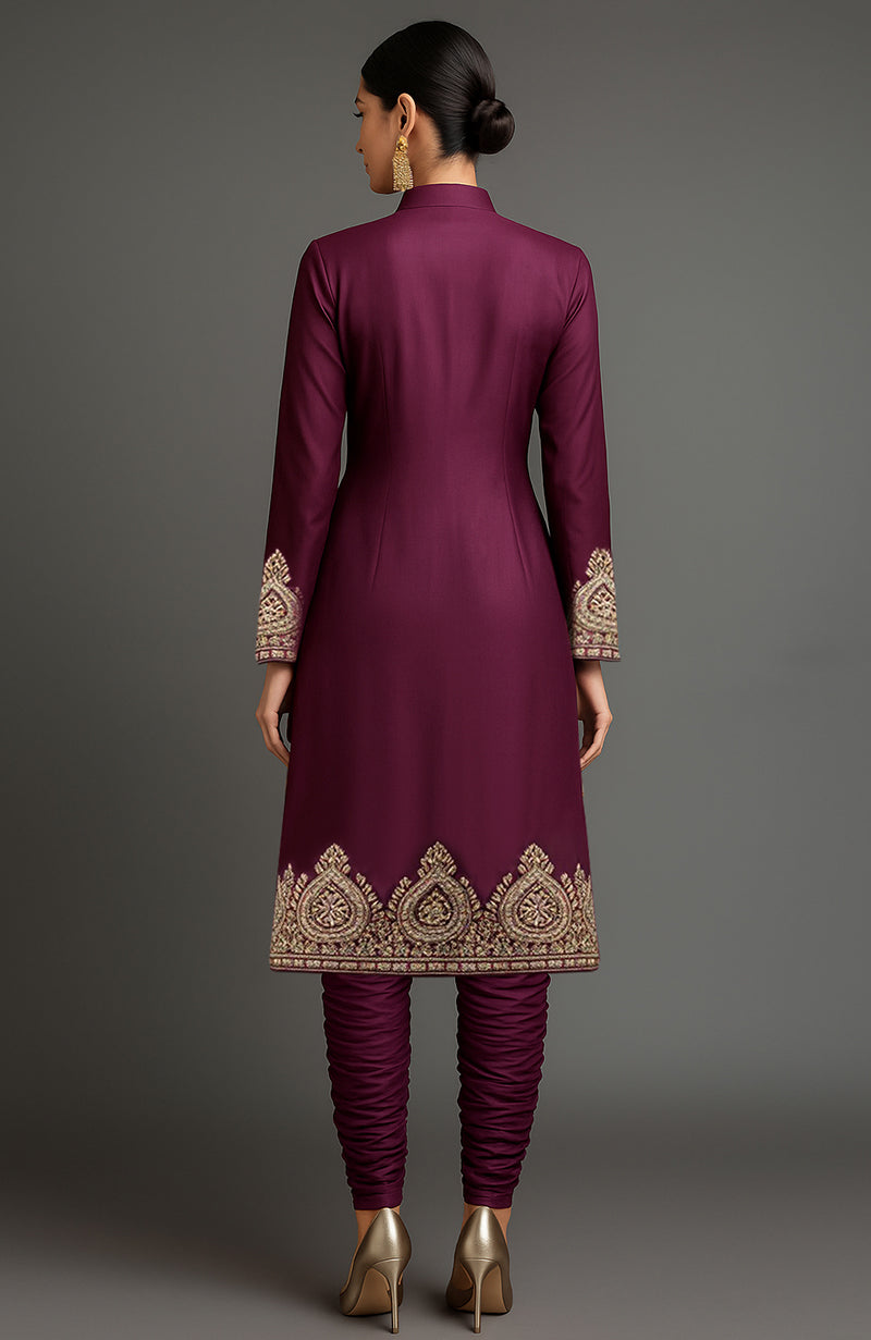 Royal plum silk jacket set with hand-embroidered gold motifs and ruched churidar pants.