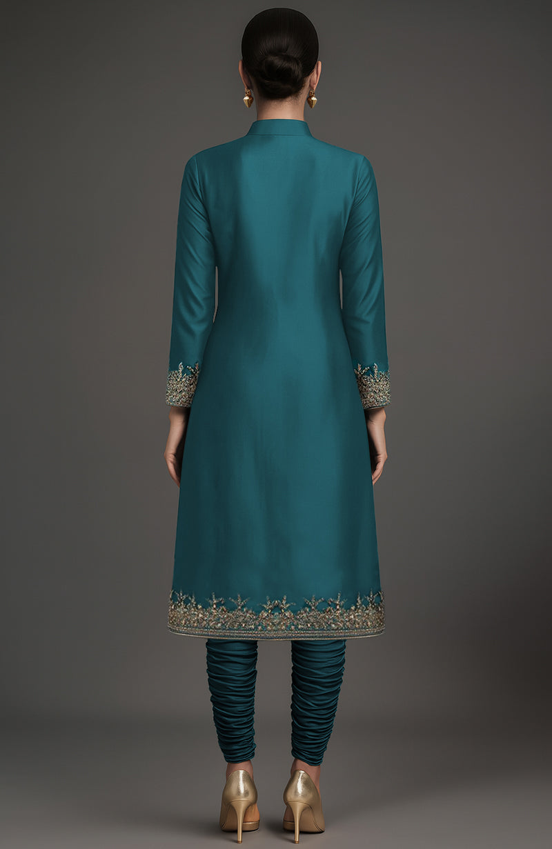 Teal silk jacket set with gold floral embroidery and ruched churidar pants in sherwani style.