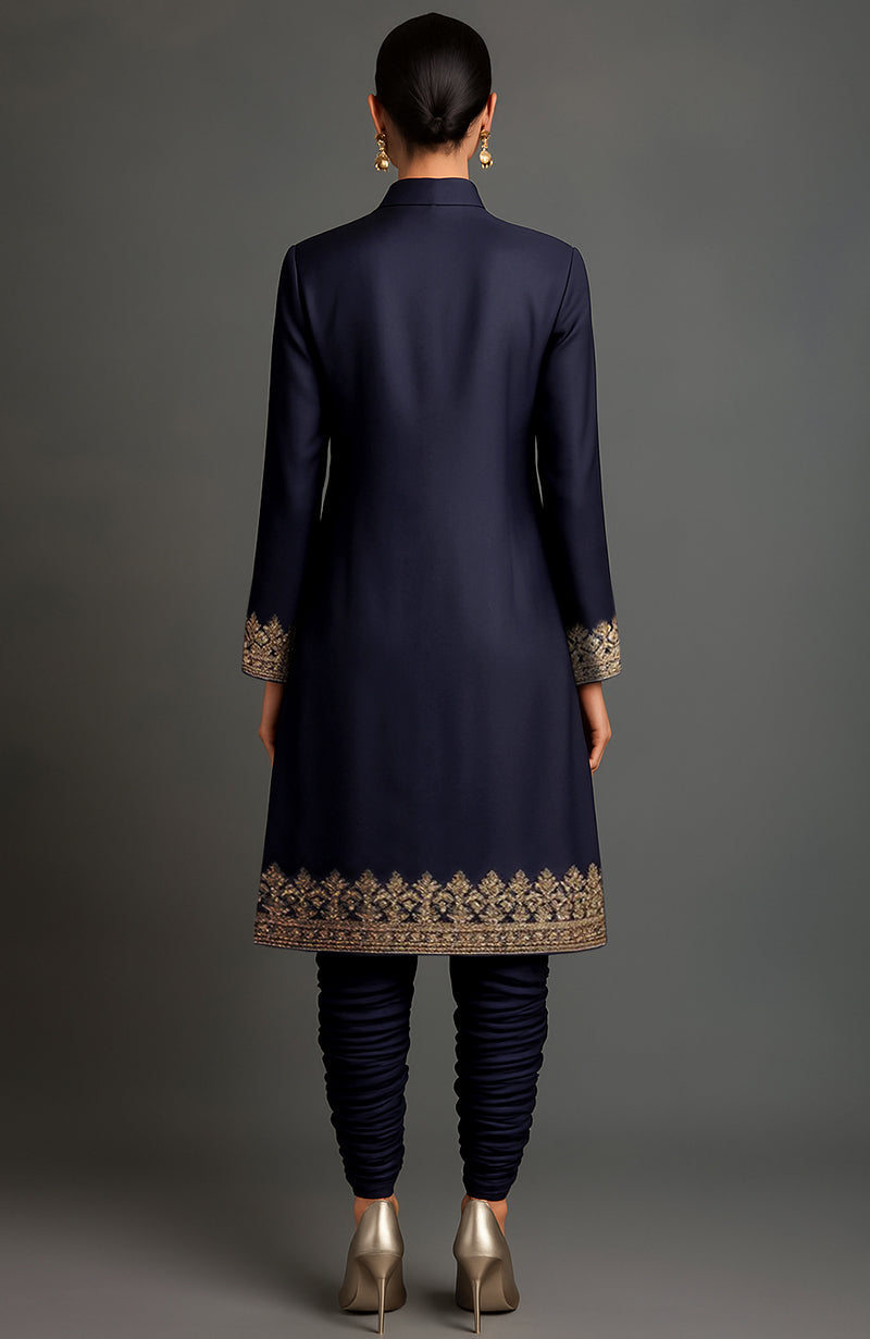 Midnight blue sherwani-style jacket with gold embroidery and matching ruched churidar trousers.