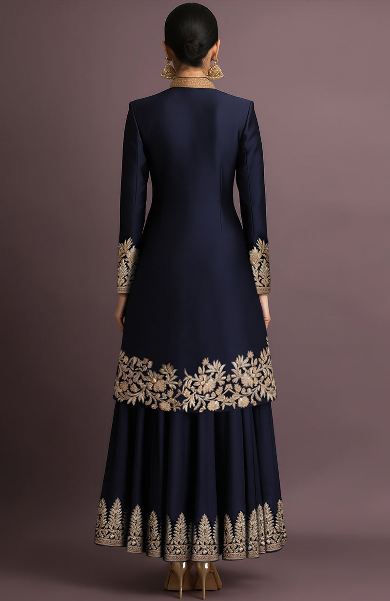 Midnight navy silk jacket set with high collar, gold embroidery, and flared skirt.