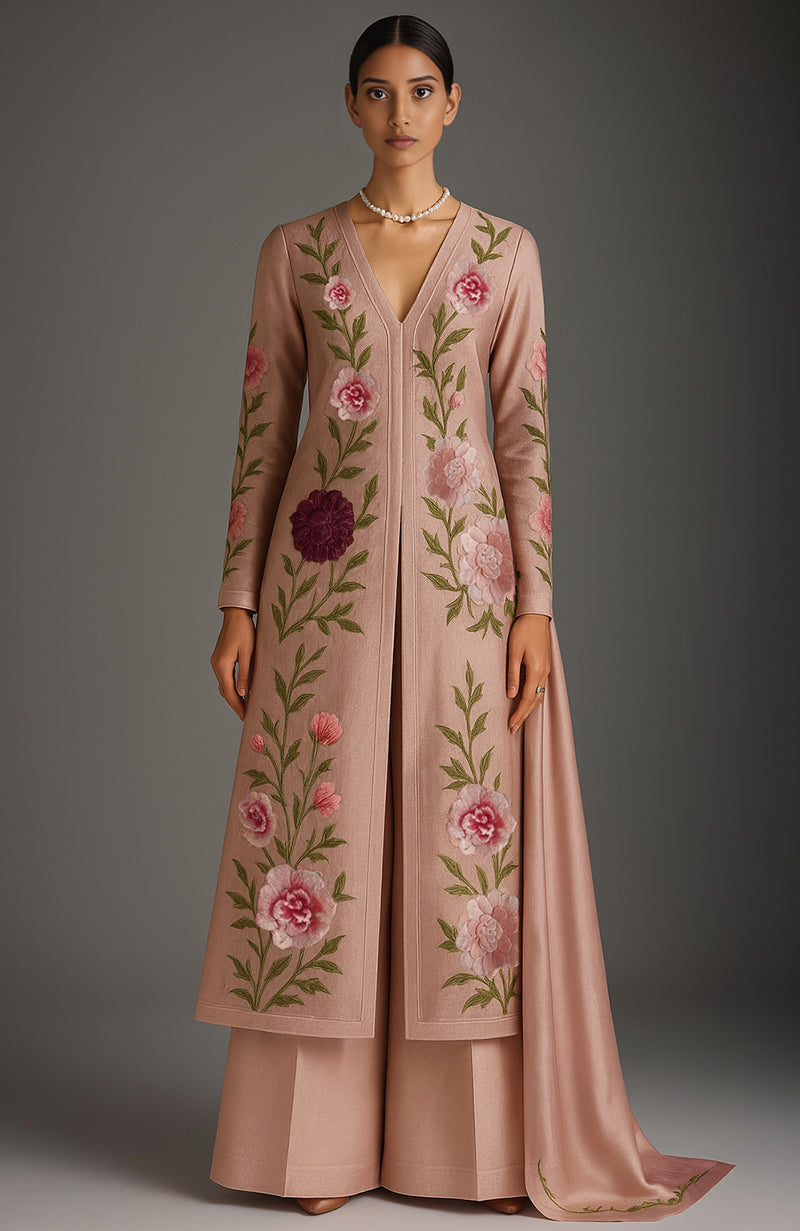 Blush pink three-piece kurta set with vertical floral embroidery and matching dupatta.