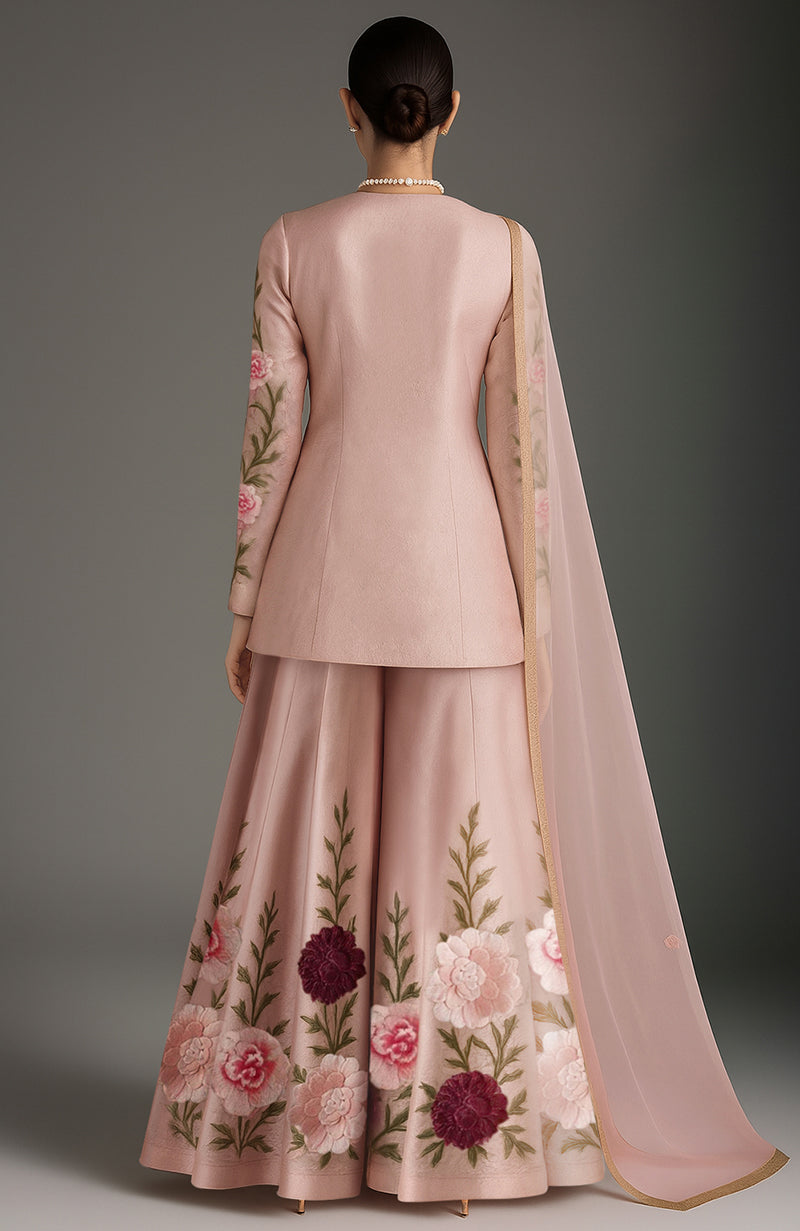 Blush pink sharara set with floral embroidery, fitted kurta, flared pants, and sheer dupatta.