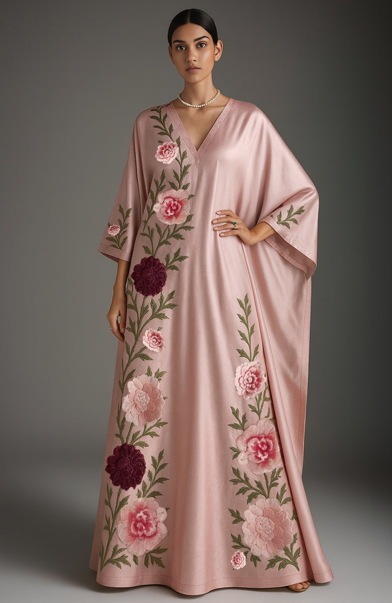 Blush pink kaftan set with floral embroidery, deep V-neck, and elbow-length sleeves.