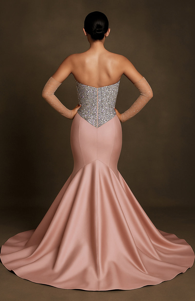 Strapless blush mermaid gown with silver crystal-encrusted bodice and flared floor-length skirt