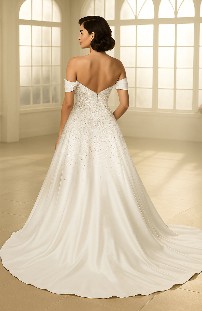 Ivory off-shoulder bridal gown with pearl-embellished bodice and flowing satin A-line skirt.