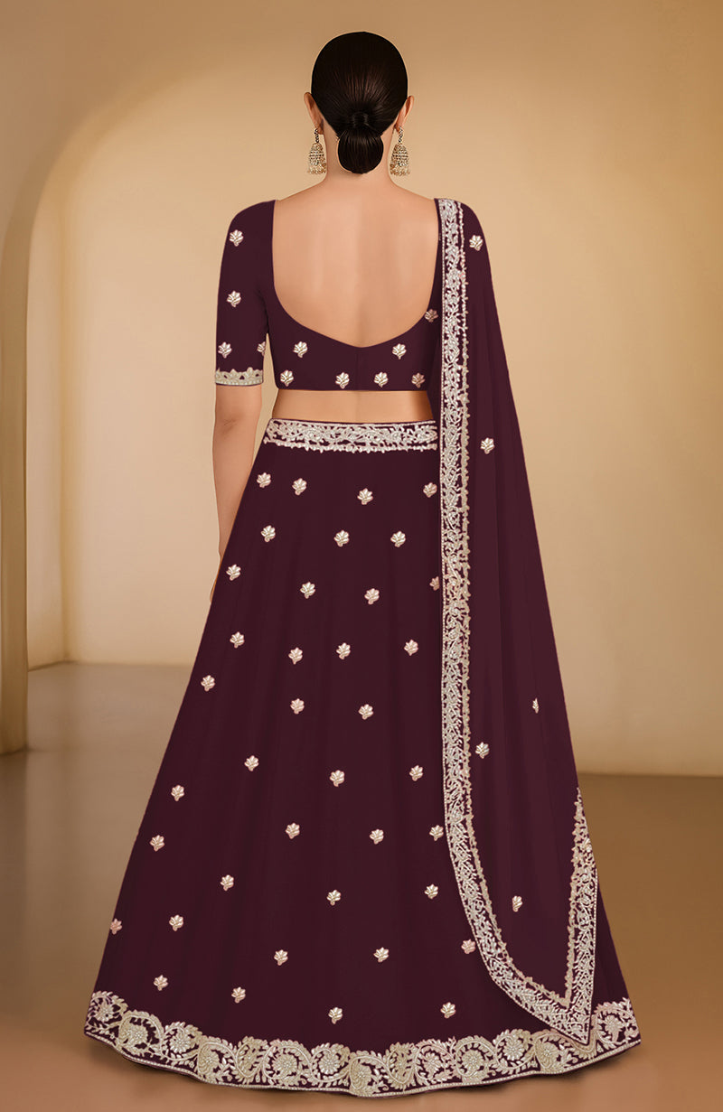 Burgundy lehenga set with gota patti and zardozi embroidery, flared A-line silhouette.