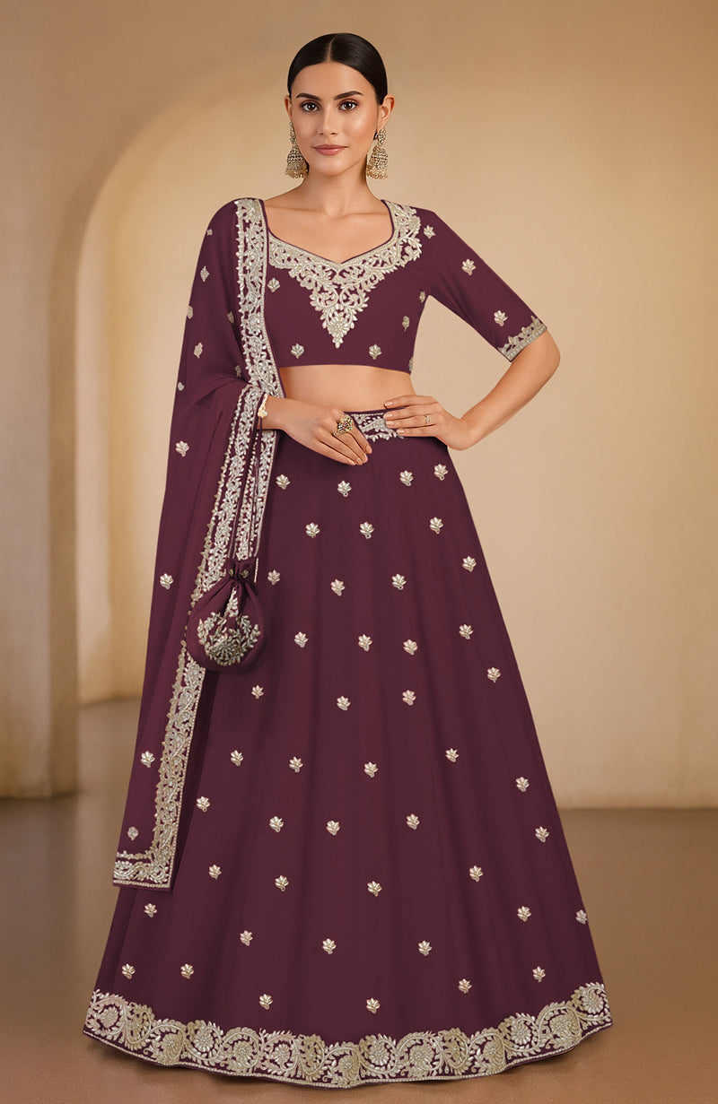 Burgundy lehenga set with gota patti and zardozi floral embroidery and matching dupatta.
