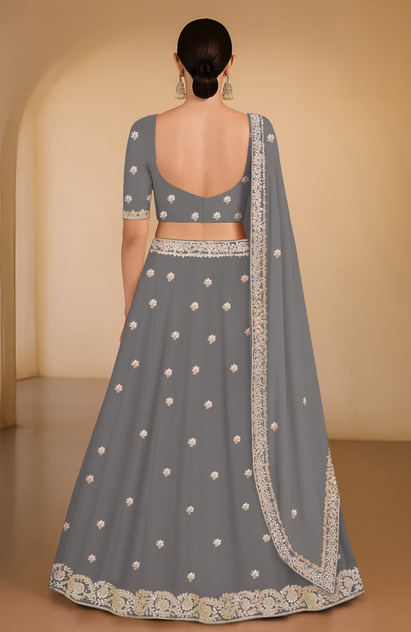 Grey lehenga set with gota patti and zardozi embroidery, includes blouse and dupatta.