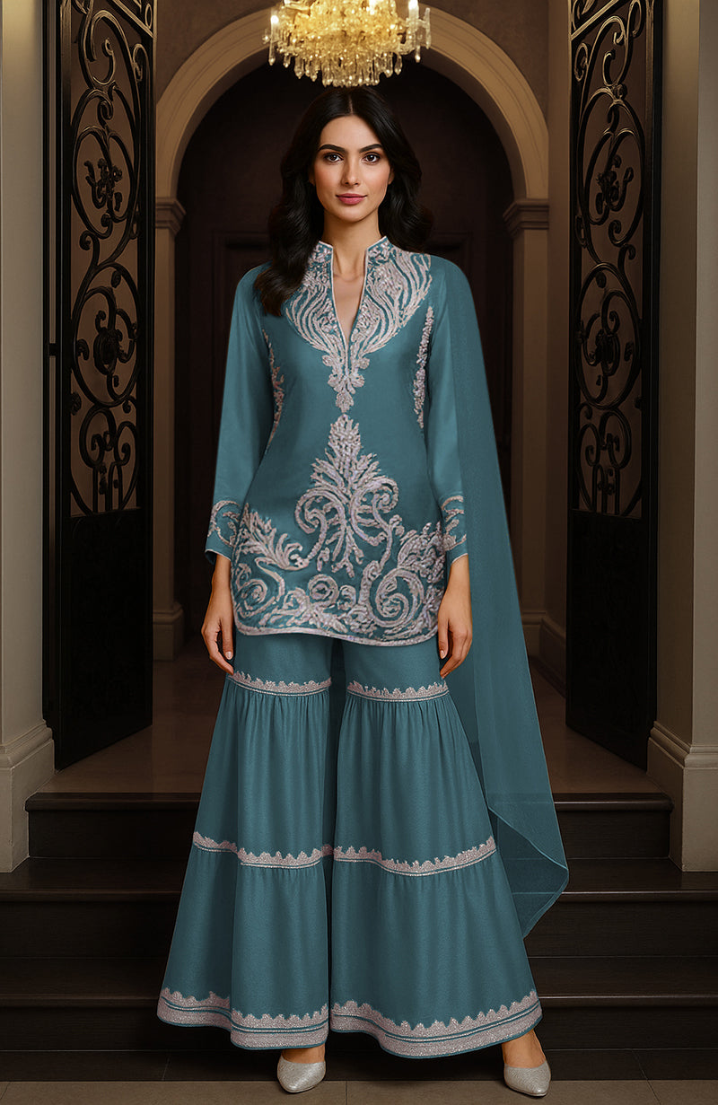 Mustard yellow gharara set with embroidered tunic, wide-legged pants, and matching drape.