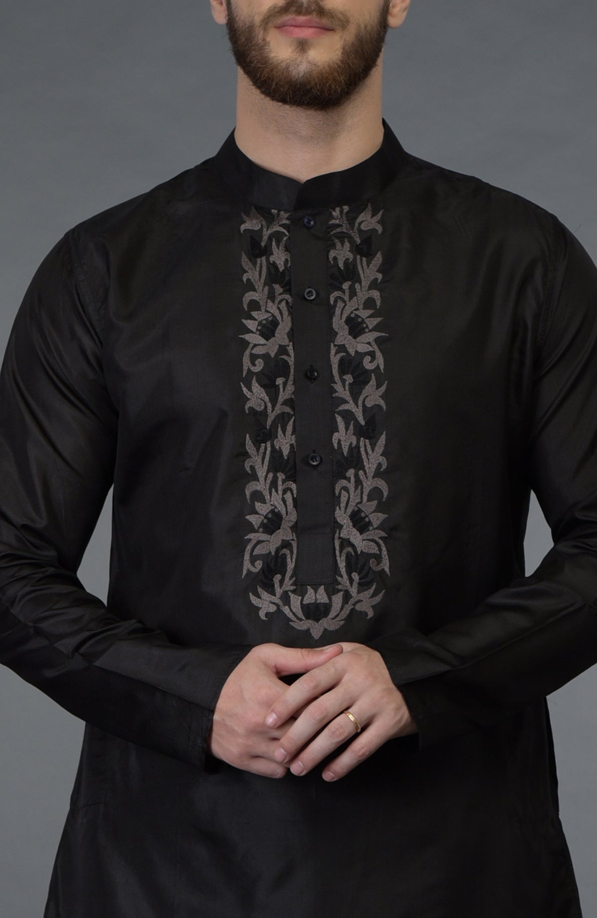 Black silk kurta with floral embroidered placket detail.