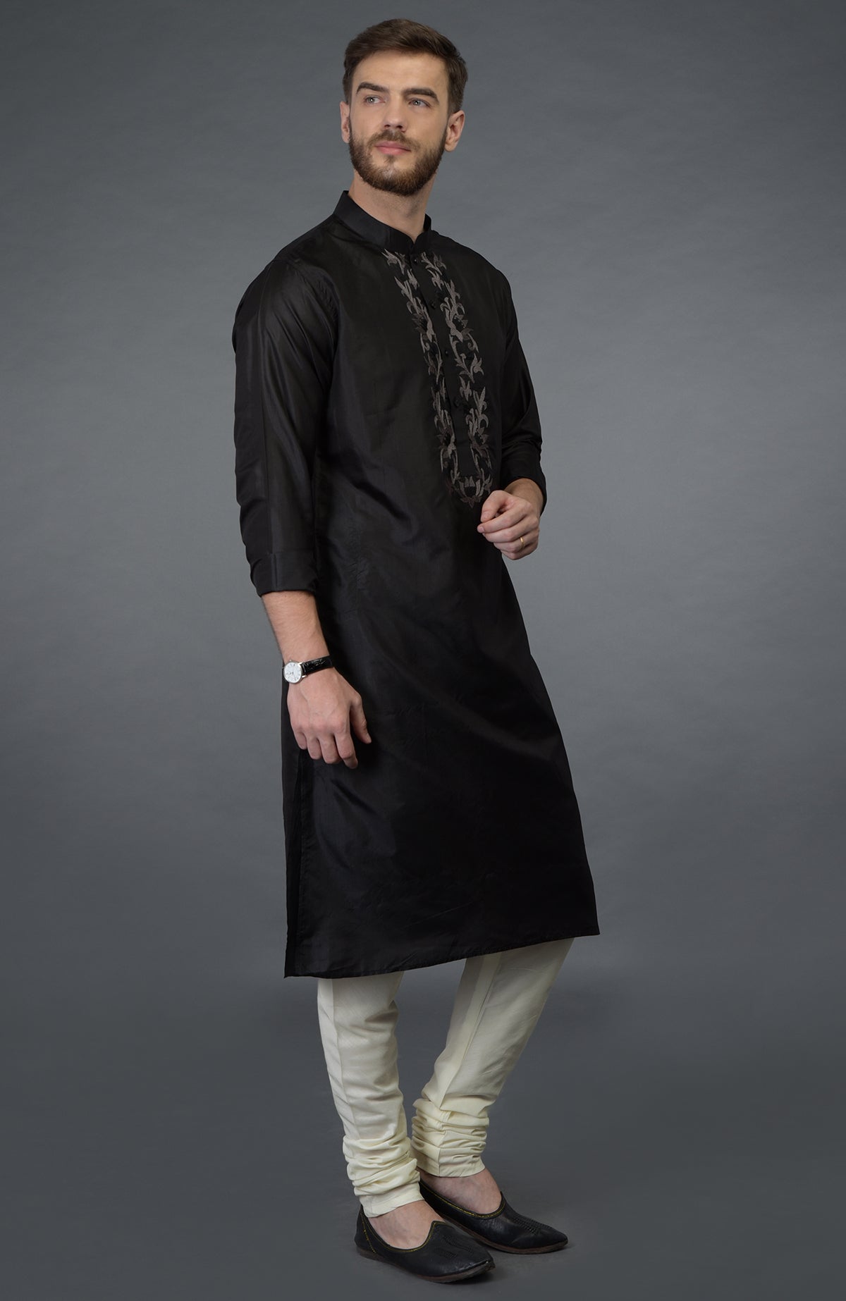 Black silk kurta with floral embroidered placket detail.