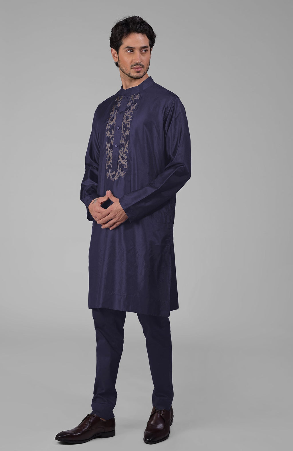 Ink blue silk kurta with floral embroidered placket detail.