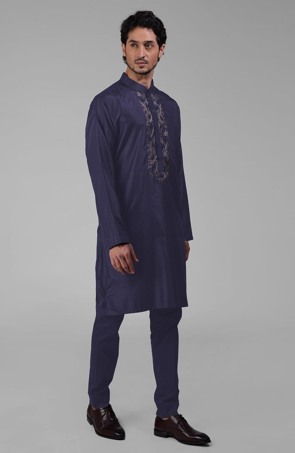Ink blue silk kurta with floral embroidered placket detail.