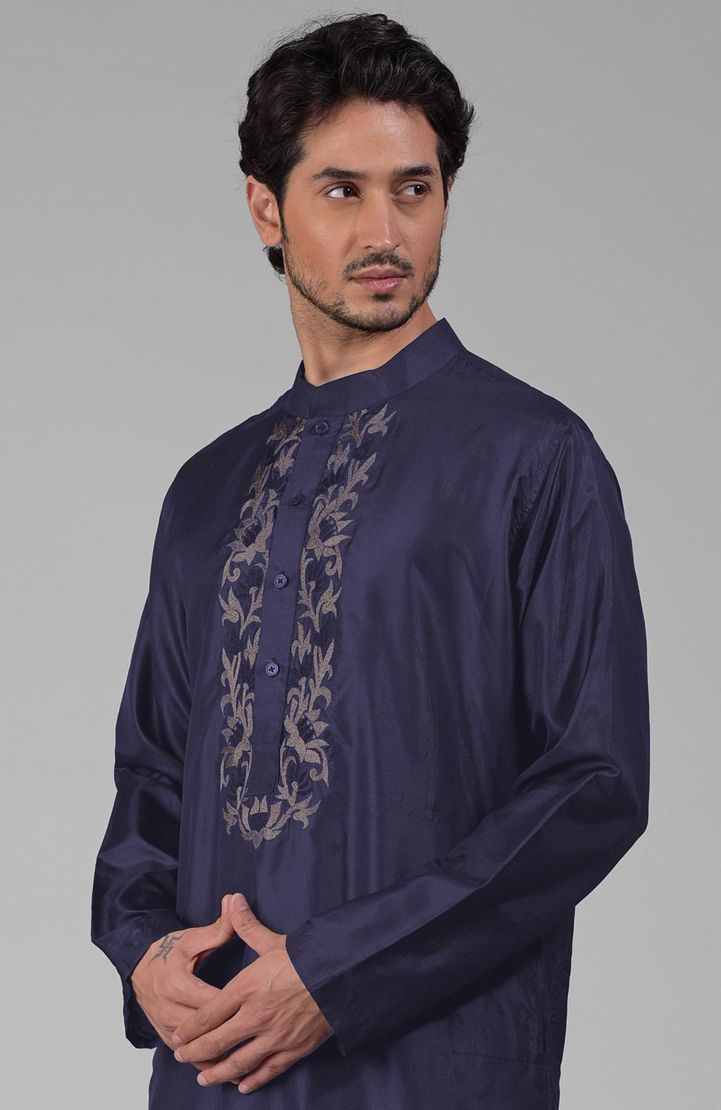 Ink blue silk kurta with floral embroidered placket detail.