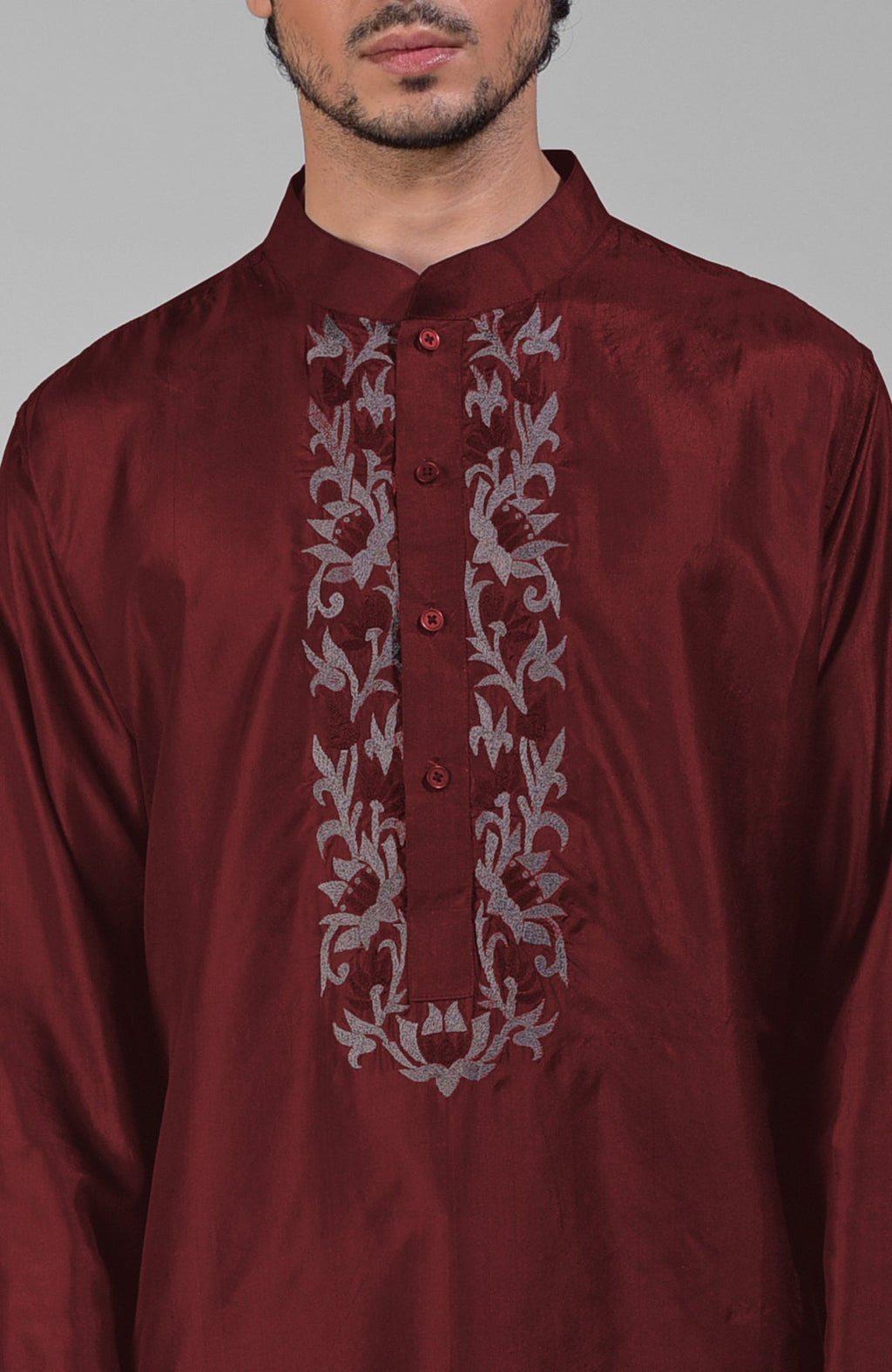 Maroon silk kurta with a floral embroidered placket and a mandarin collar.