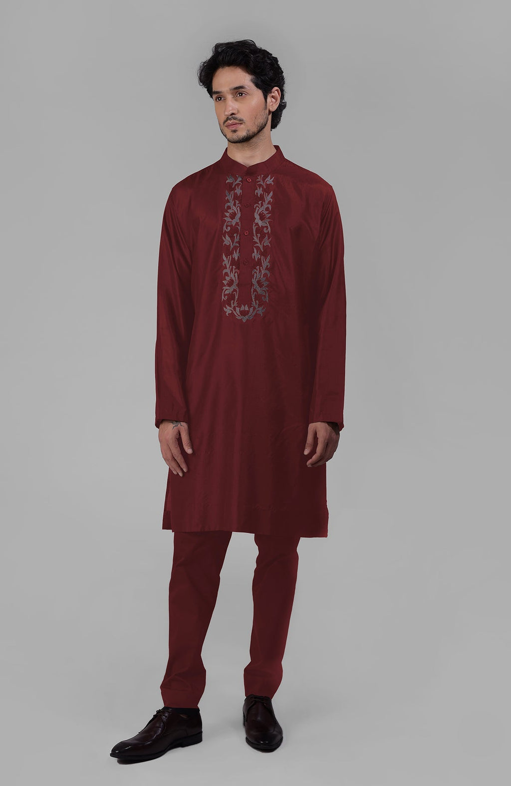 Wine silk kurta with floral embroidered placket detail.