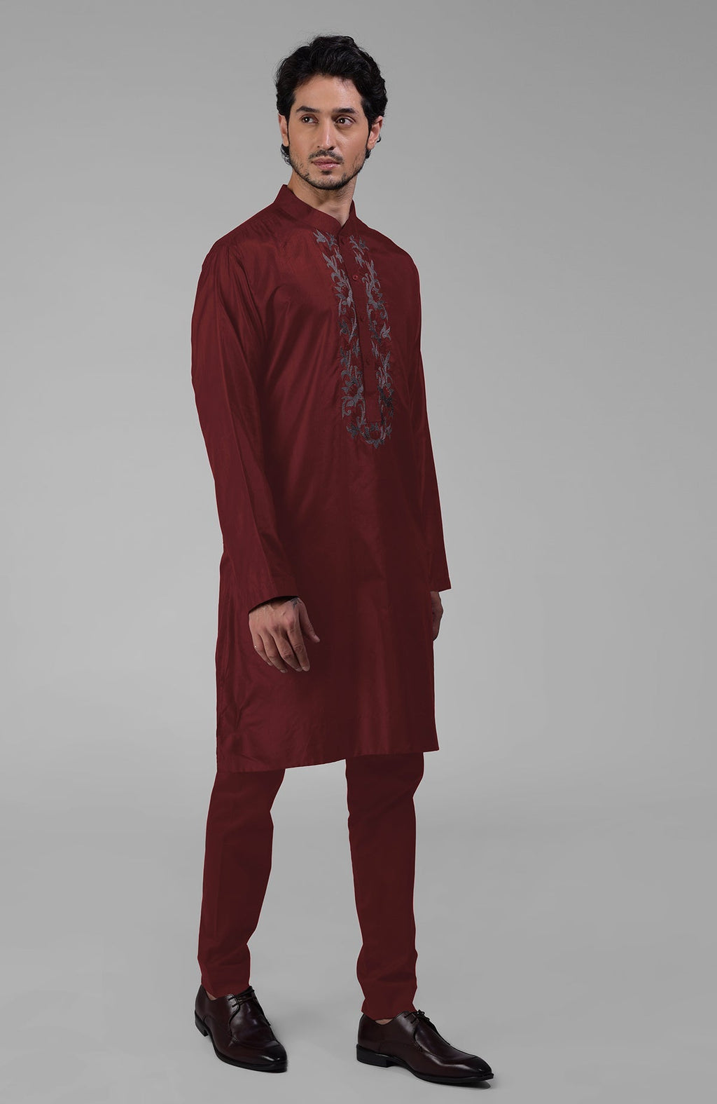 Maroon silk kurta with floral embroidered placket and matching pants.