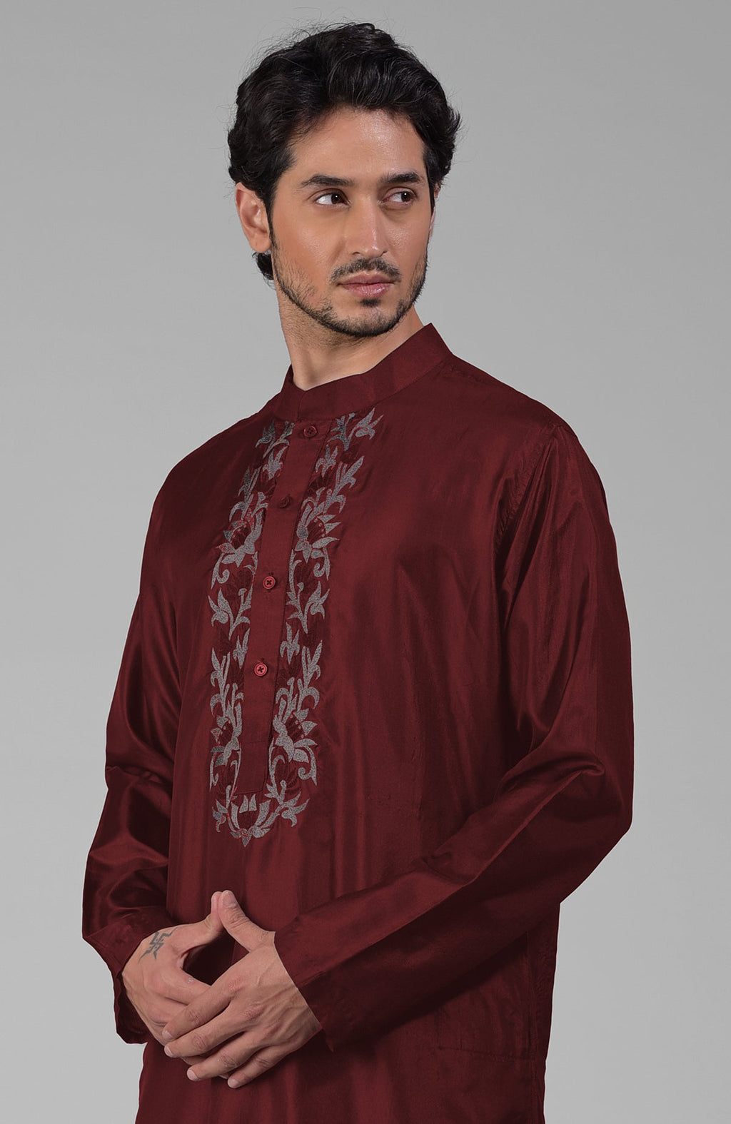 Maroon silk kurta with floral embroidered placket detail.