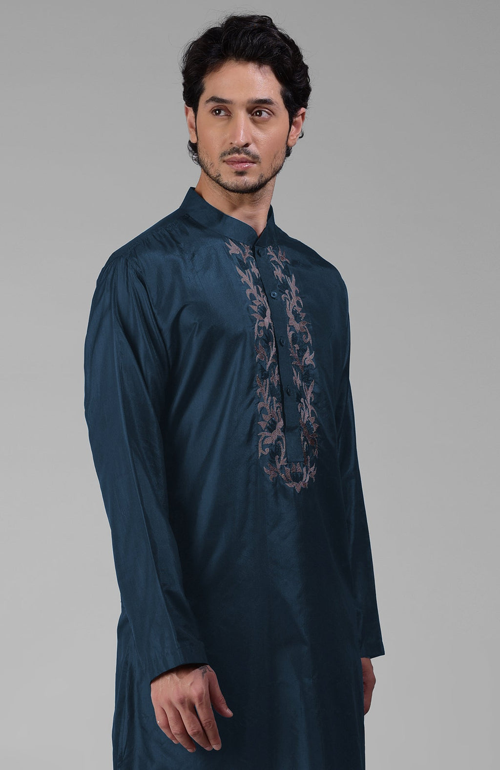Teal silk kurta with floral embroidered placket detail.