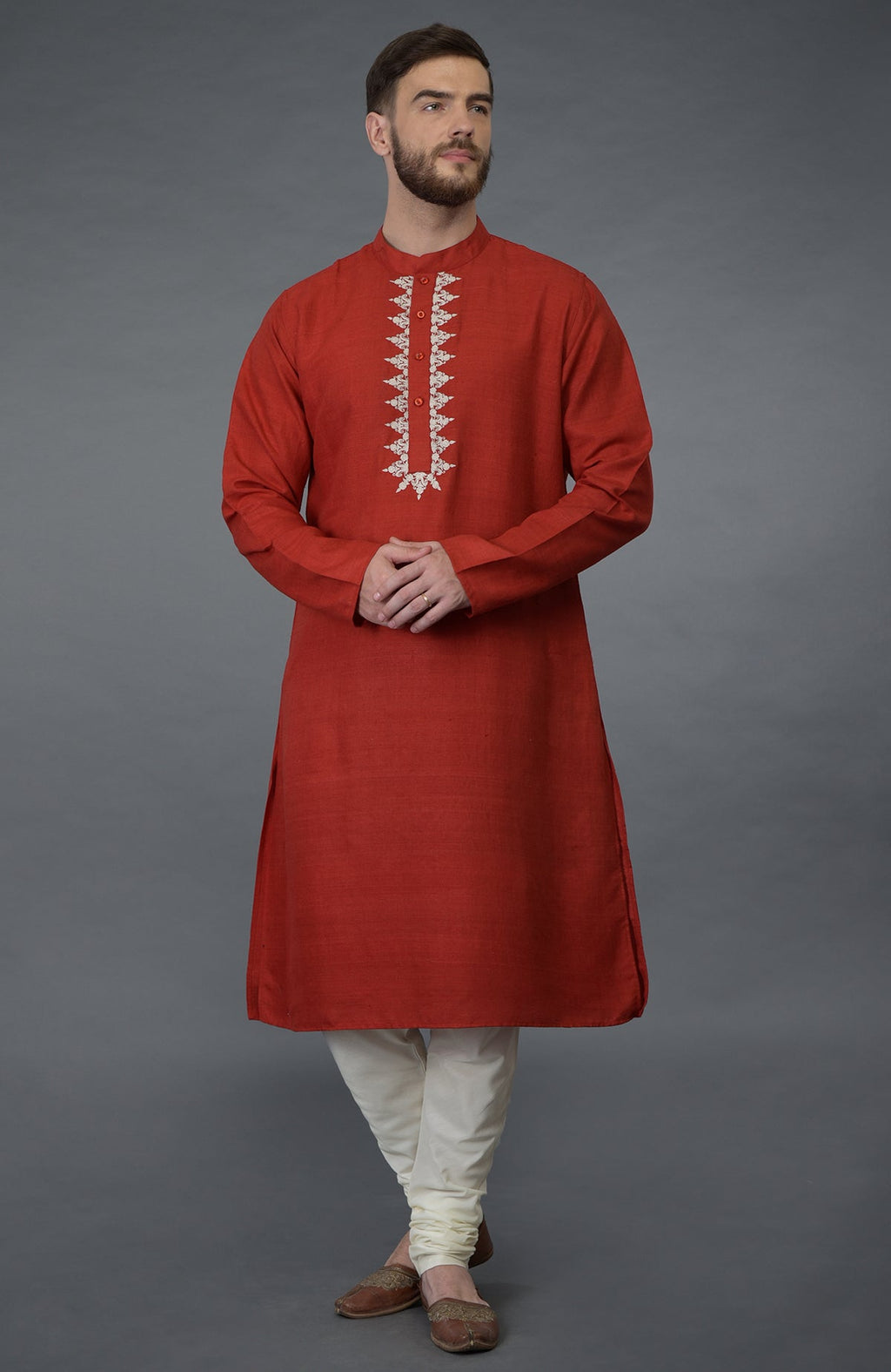 Red pure silk kurta with floral embroidered placket and ivory churidar.