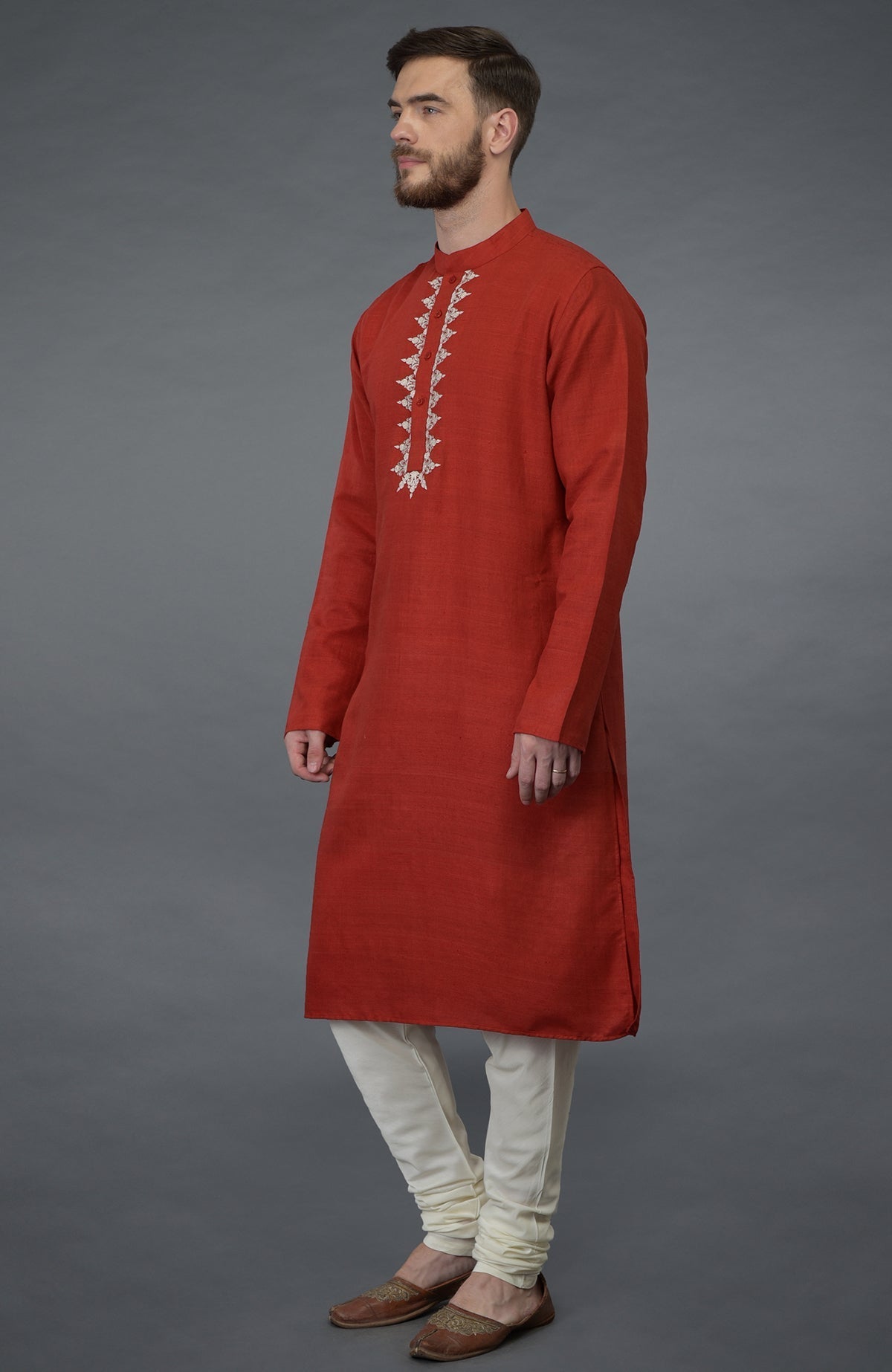 Red pure silk kurta with floral embroidered placket and ivory churidar.