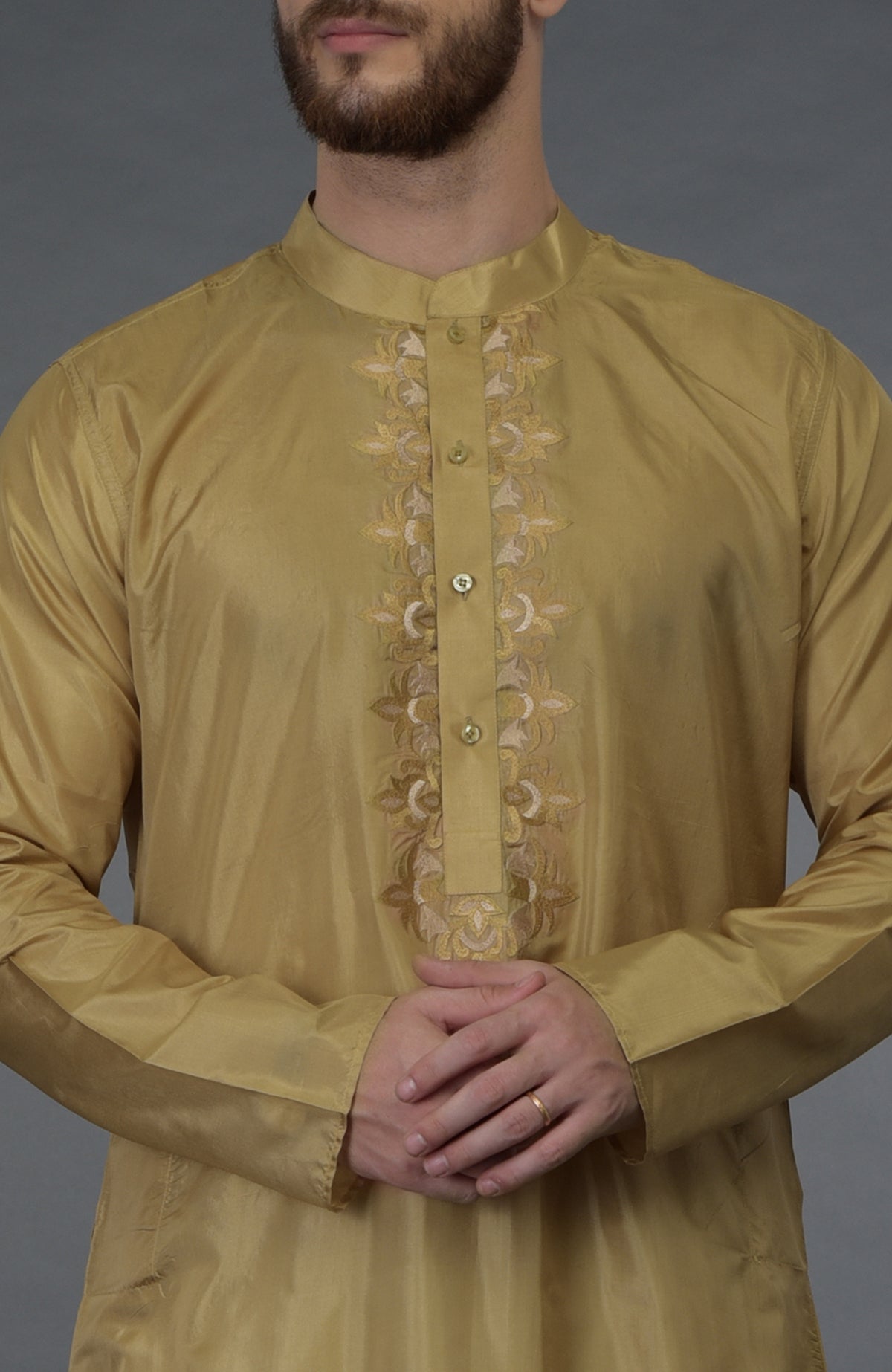 Gold silk kurta with floral embroidery and a buttoned placket.