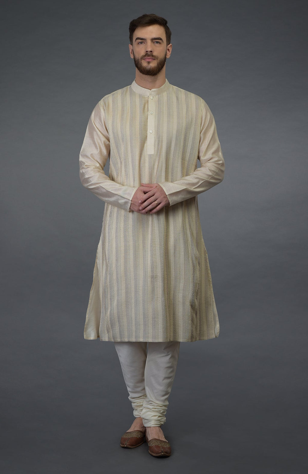 Cream pintuck pure silk kurta set with a striped kurta and matching churidar.