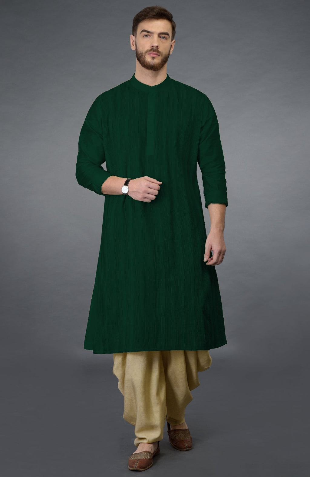 Bottle green long kurta with pintuck stitch and beige gold dhoti salwar pants.
