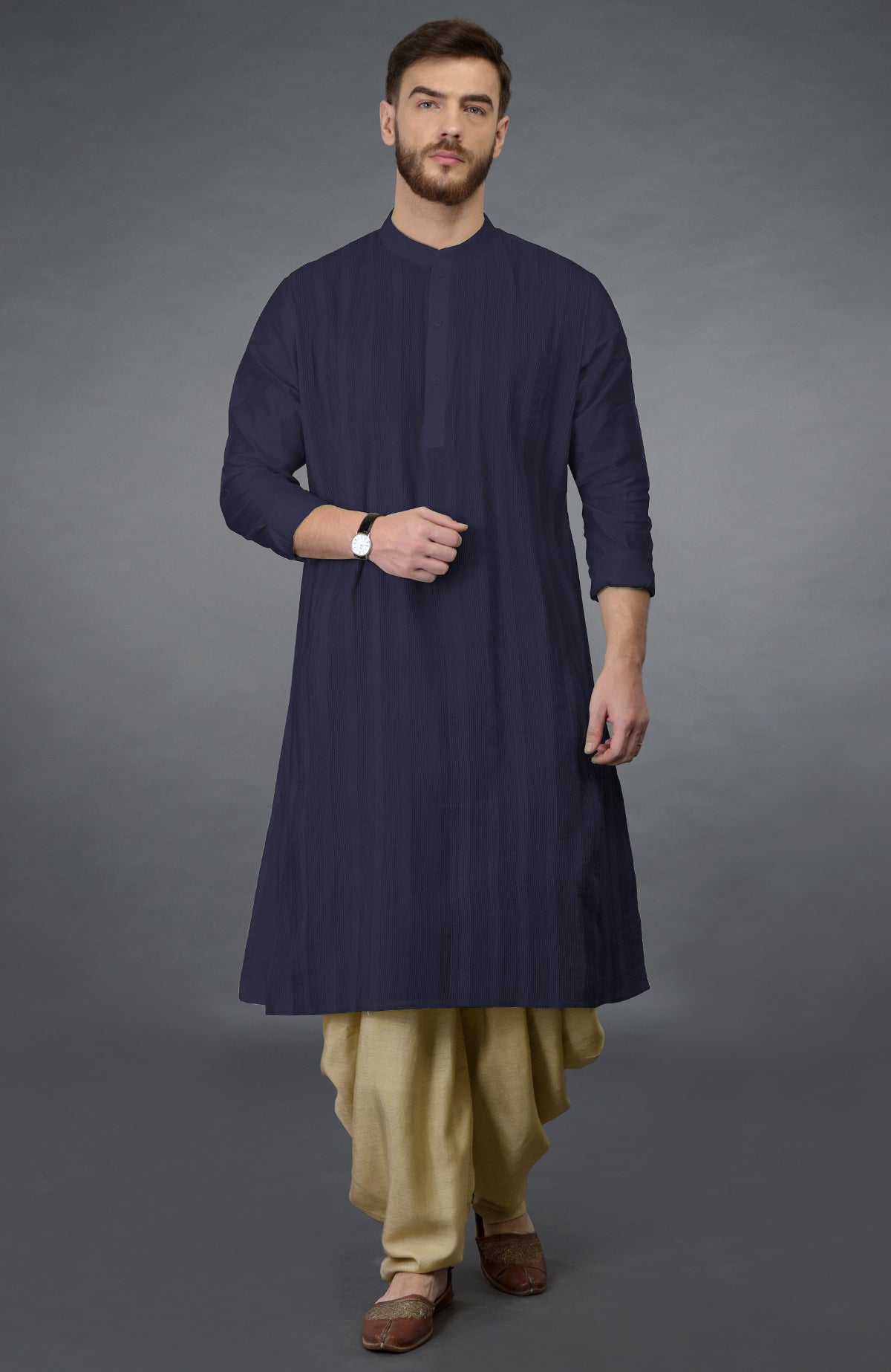 Eclipse blue kurta with pintuck stitch and long sleeves paired with beige gold dhoti salwar pants.