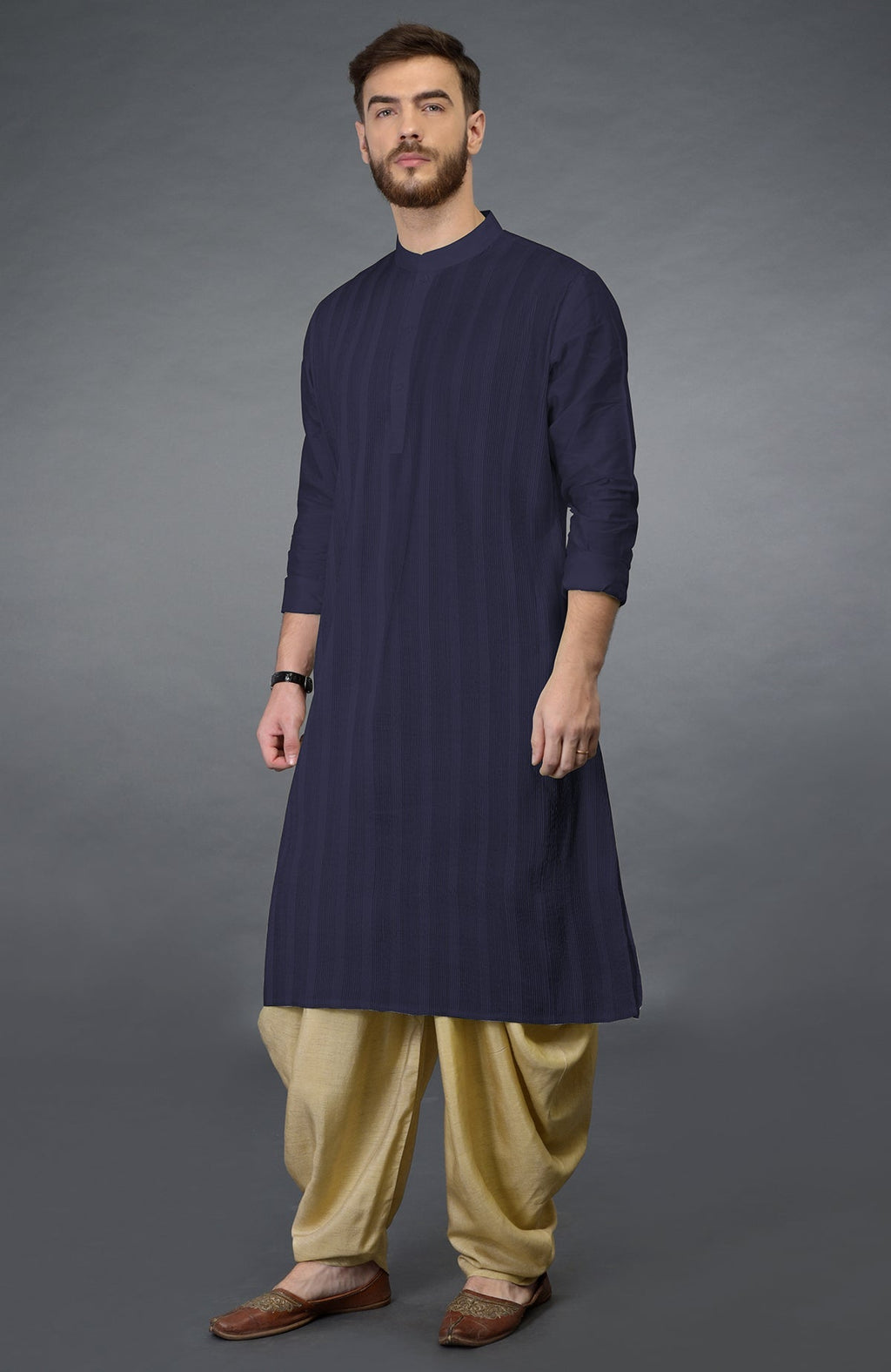 Eclipse blue kurta with pintuck stitching and long sleeves paired with beige gold dhoti salwar pants.