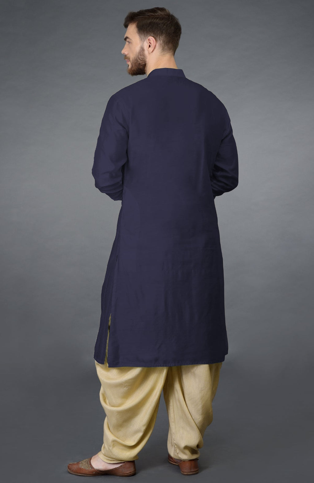 Eclipse blue kurta with pintuck stitch and long sleeves paired with beige gold dhoti salwar pants.