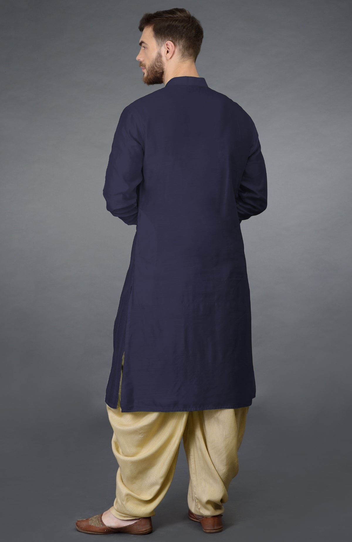Eclipse blue kurta with pintuck stitch and long sleeves paired with beige gold dhoti salwar pants.