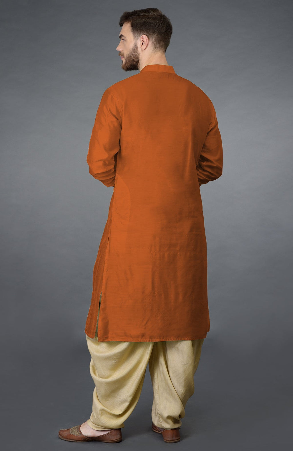 Gold flame kurta with pintuck details and beige gold dhoti salwar pants set.
