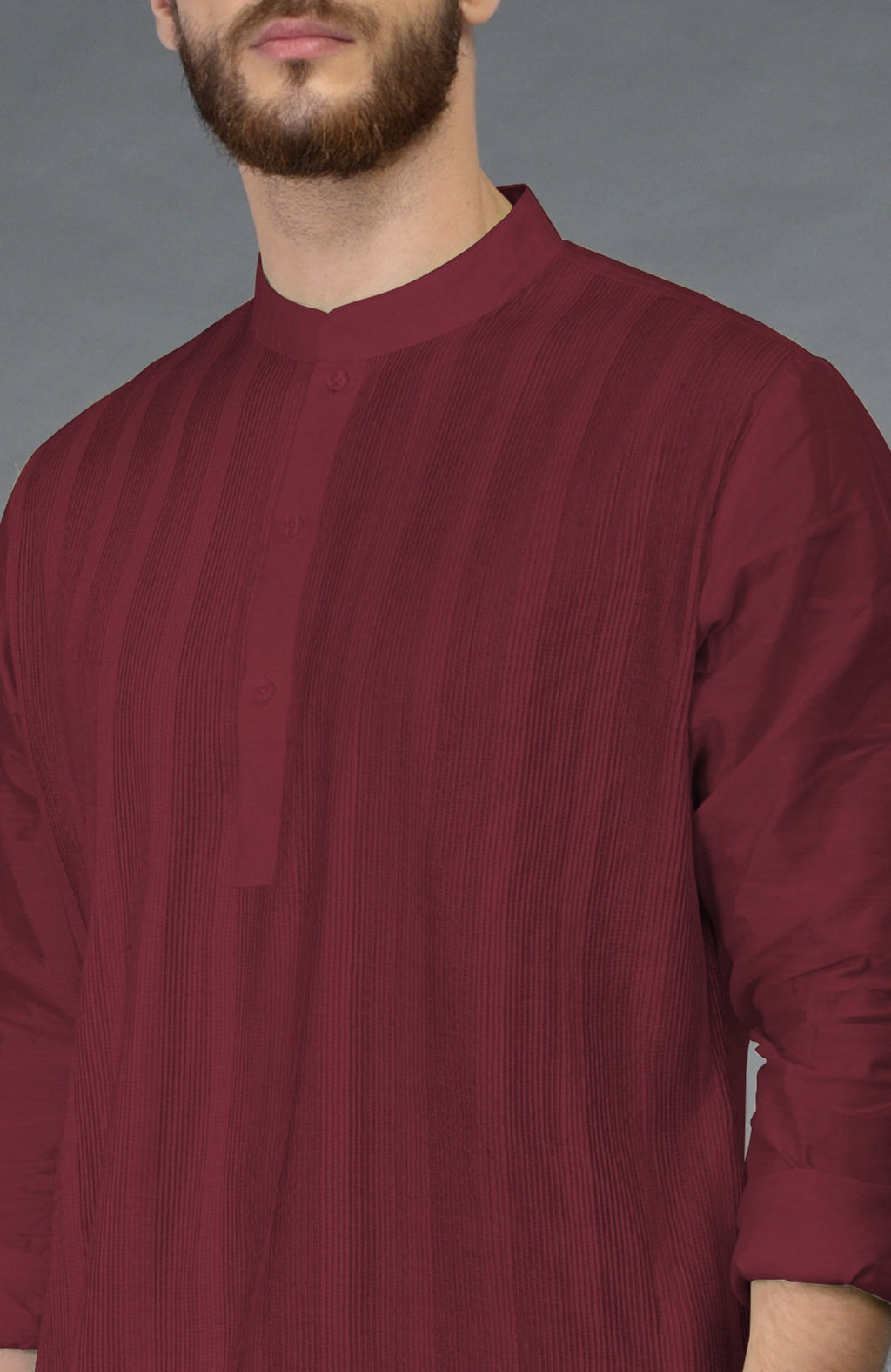 Pomegranate kurta with pintuck detailing and long sleeves paired with beige gold dhoti salwar pants.