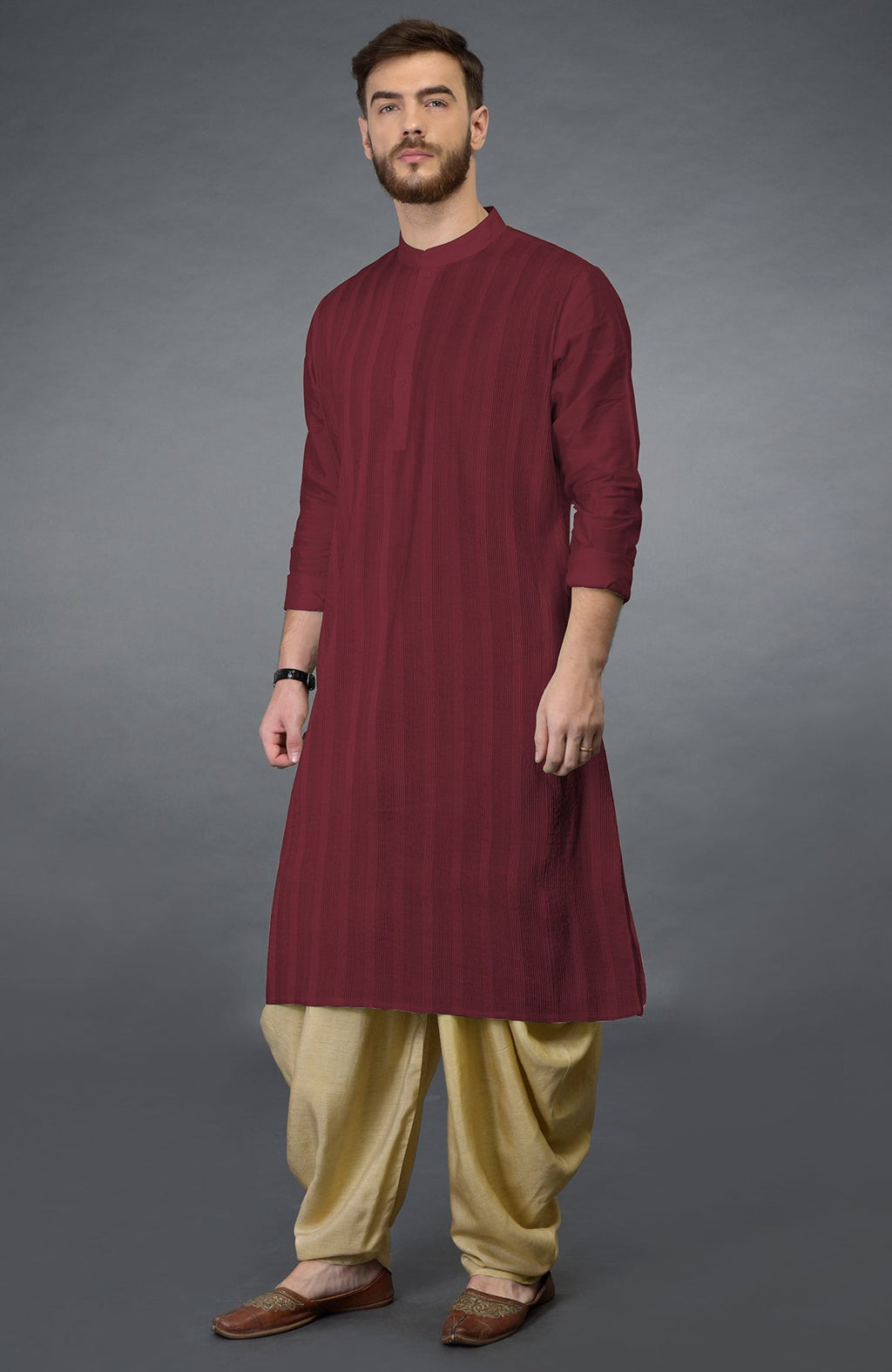 Pomegranate kurta with pintuck stitch and long sleeves paired with beige gold dhoti salwar pants
