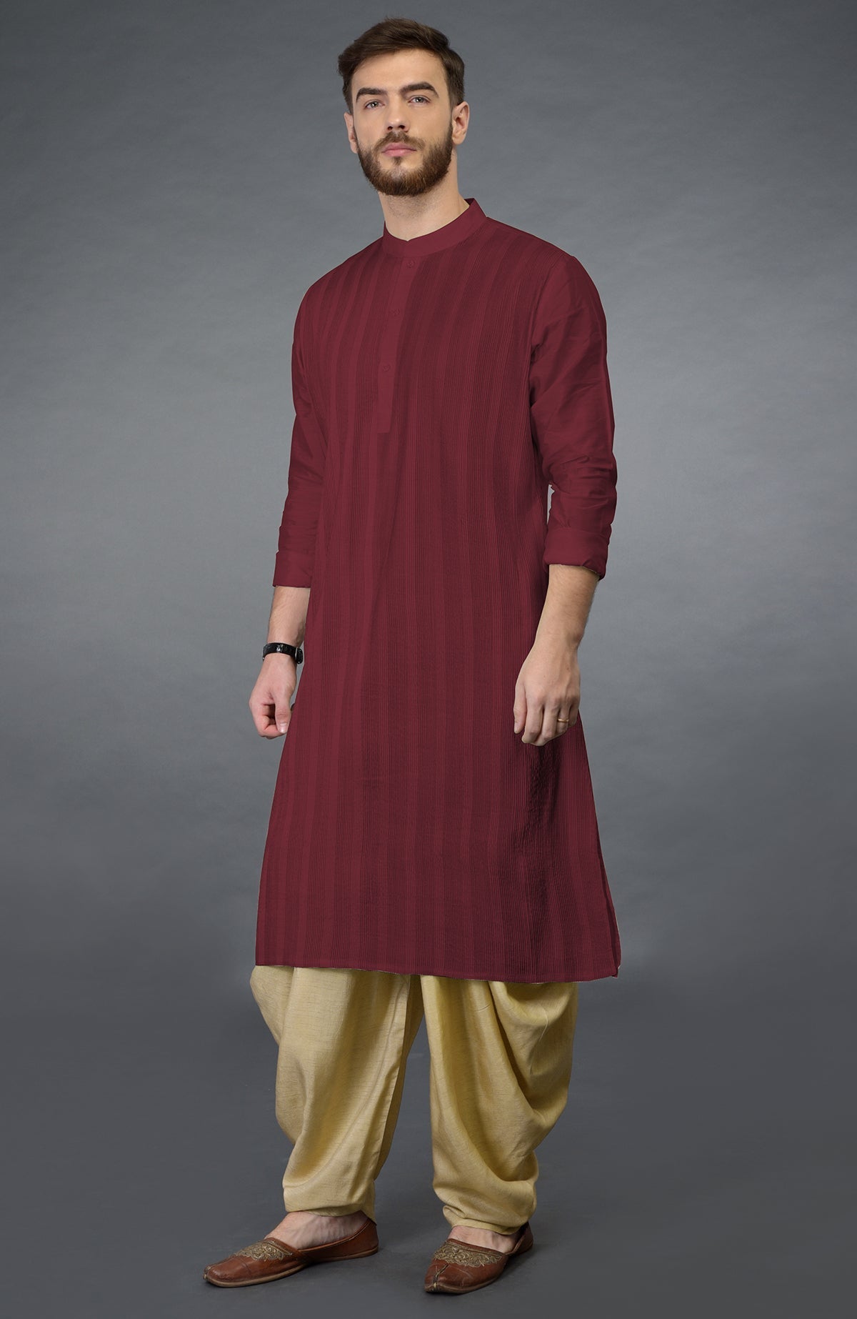 Pomegranate kurta with pintuck stitch and long sleeves paired with beige gold dhoti salwar pants