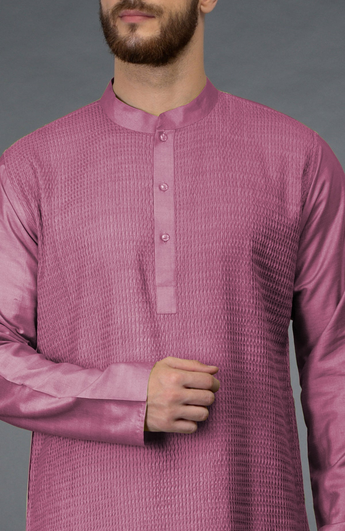 A man wears a wine-colored kurta with pintuck detailing and a band collar.