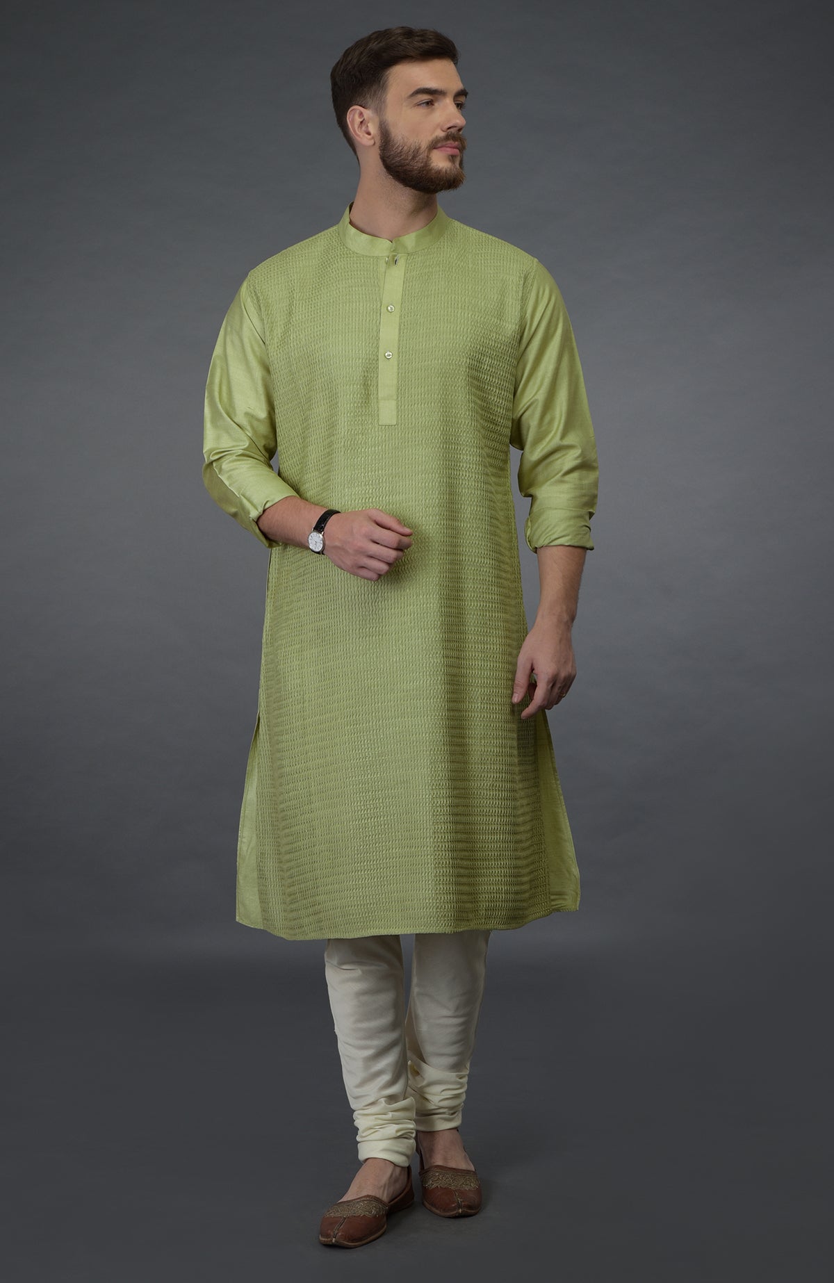 Pista green pintuck silk kurta with a band collar and full sleeves.