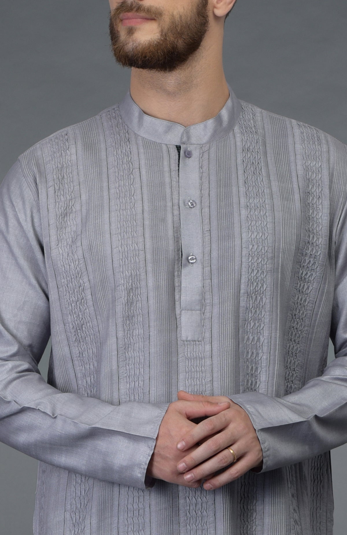 Grey pintuck silk kurta with a band collar and buttoned placket.