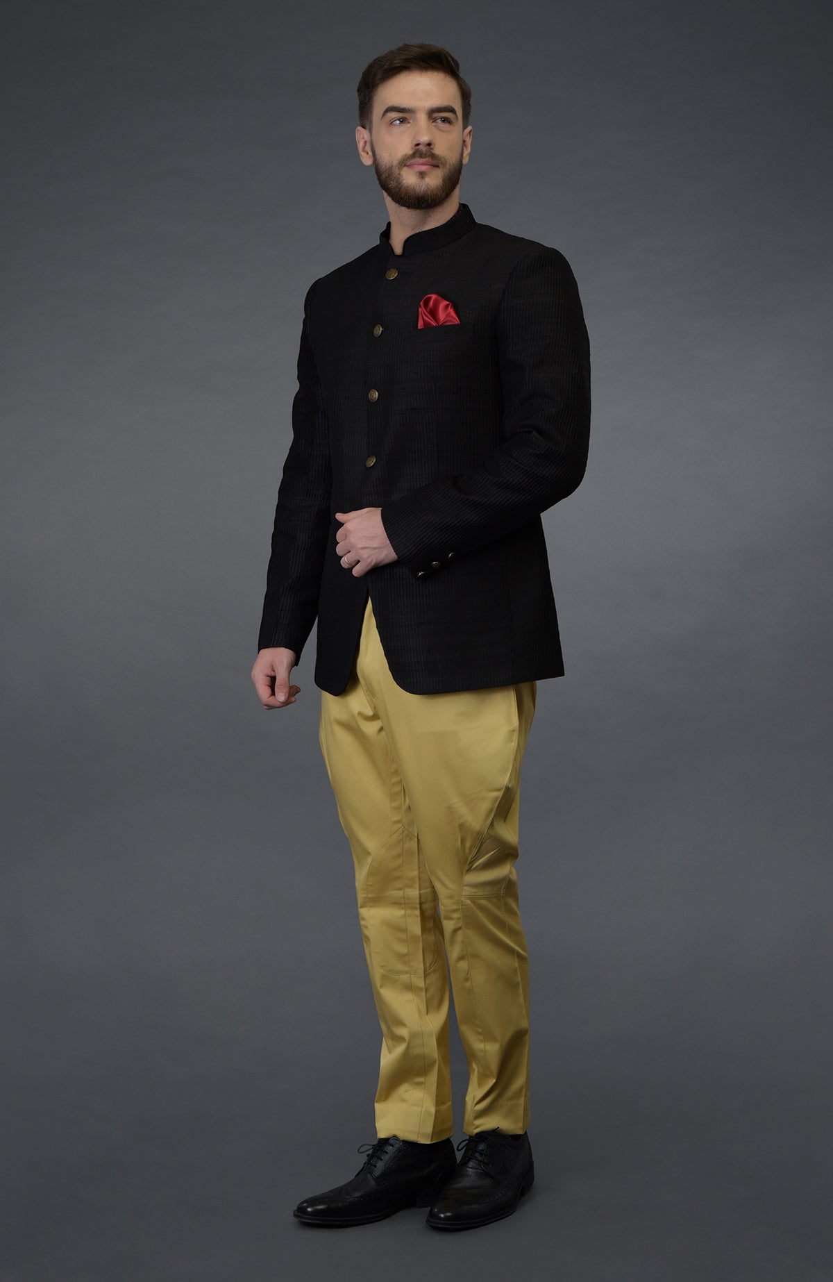 Black pintuck bandhgala jacket set with camel beige breeches.