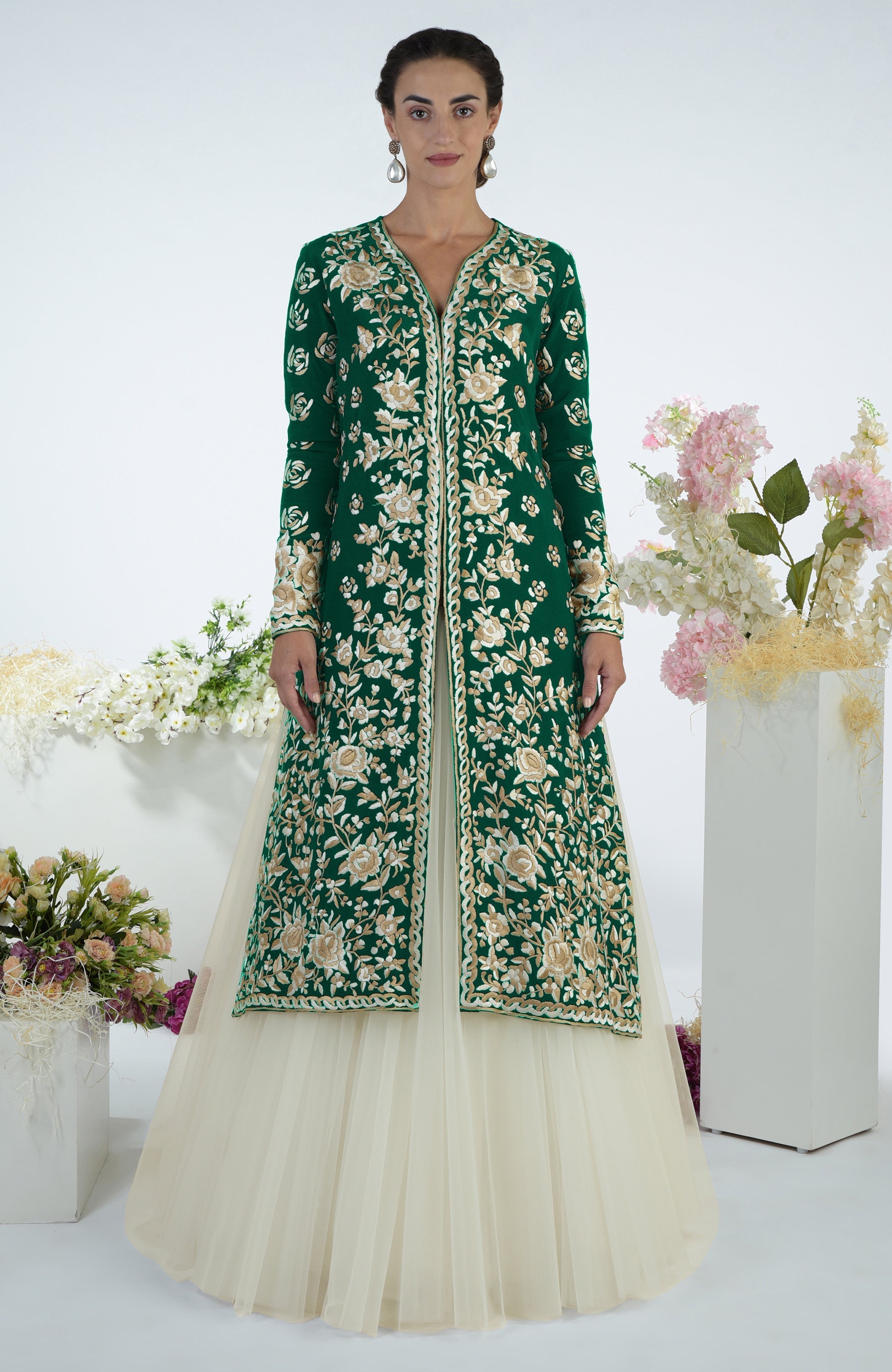 Emerald green jacket with ivory floral Parsi Gara embroidery paired with a full volume tulle skirt