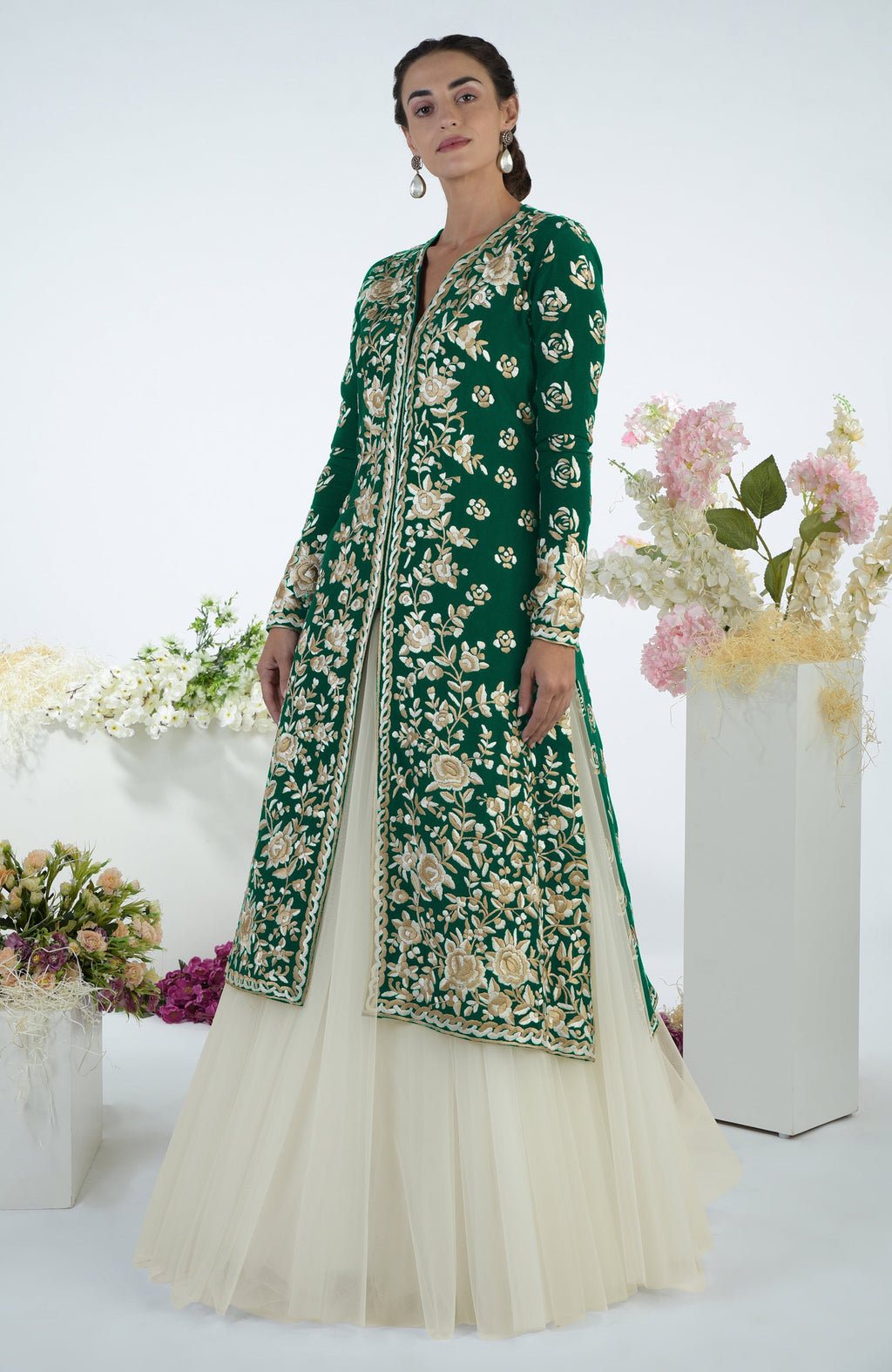 Emerald green jacket with ivory floral Parsi Gara embroidery paired with a full volume tulle skirt