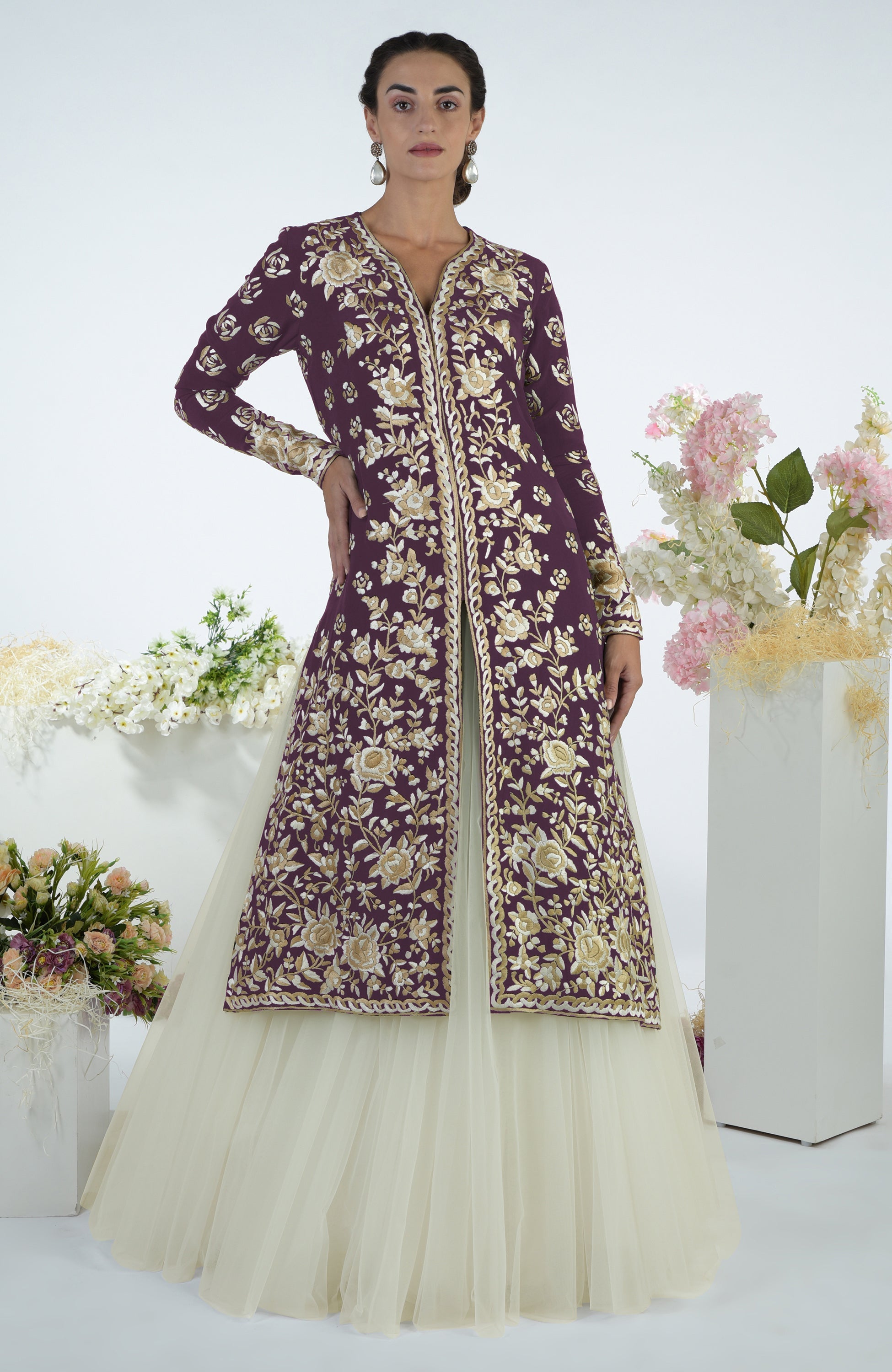 Emerald green jacket with ivory floral Parsi Gara embroidery paired with a full volume tulle skirt