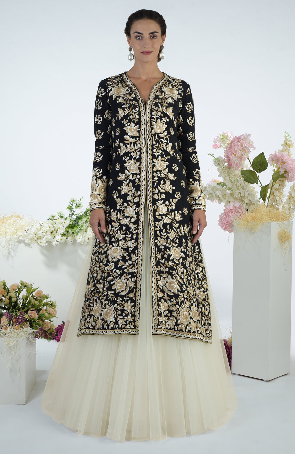 Black jacket with ivory floral Parsi Gara embroidery paired with a full volume tulle skirt